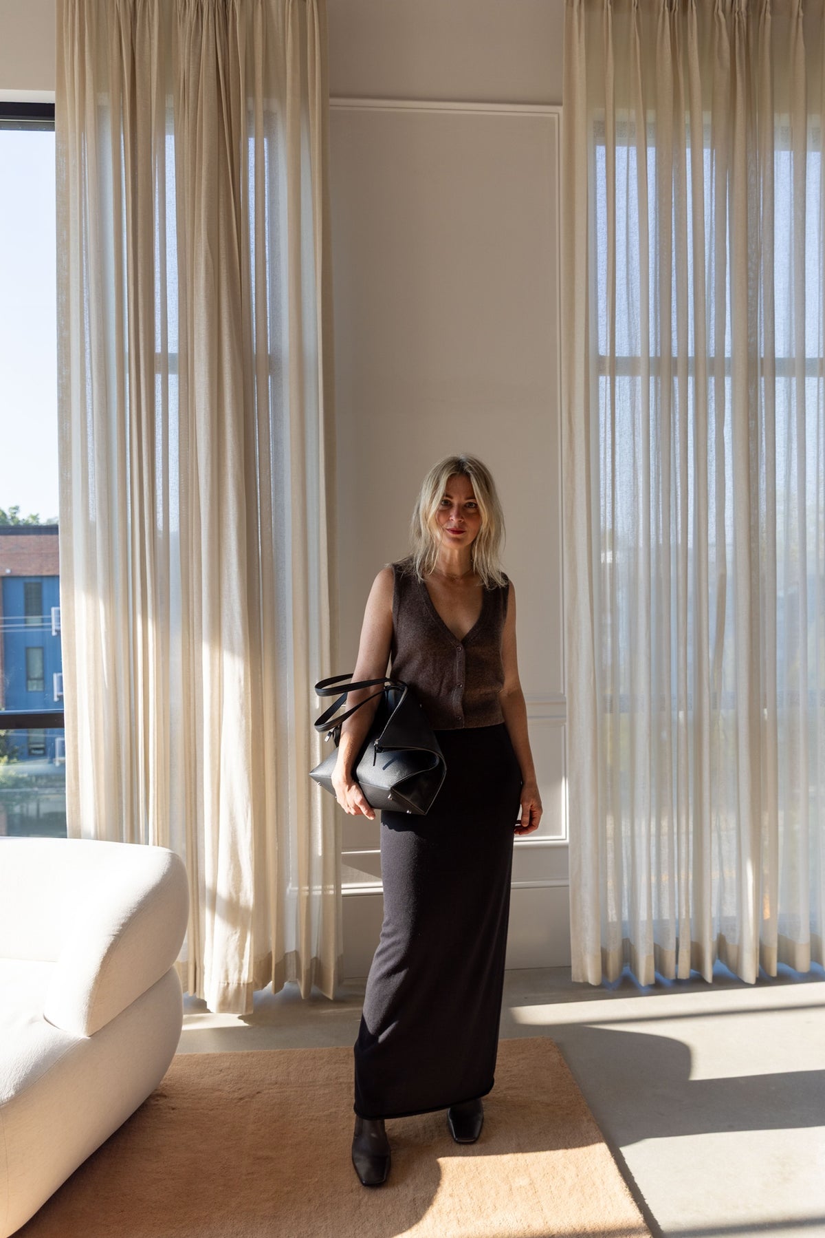Lisa Yang Charlotta Skirt, longline cotton cashmere knit, styled with the Eterne Leroy vest and Aesther Ekme foldover bag