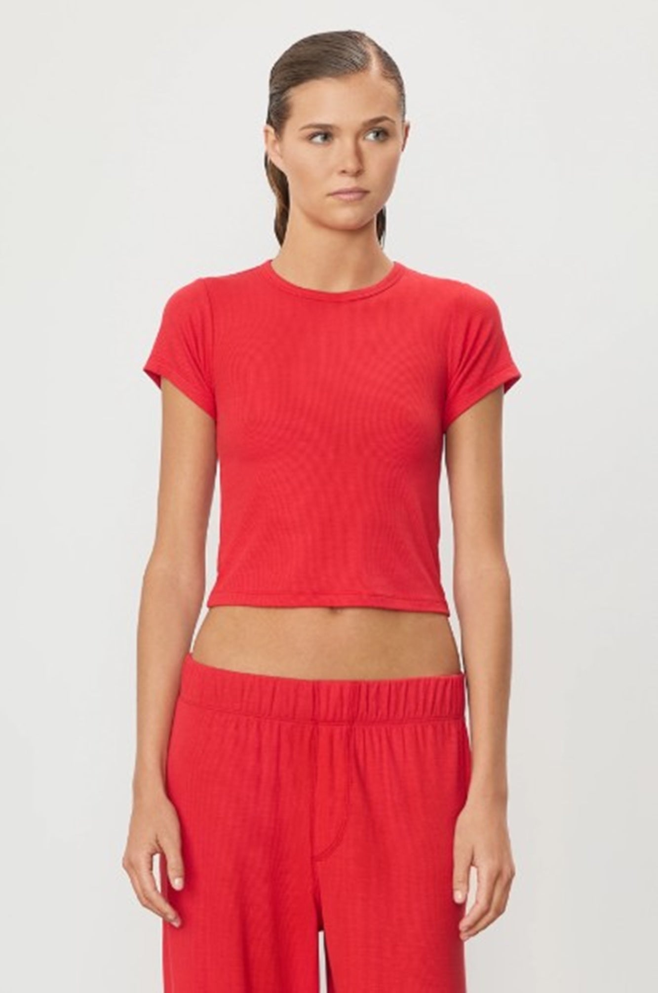 image of a model wearing the Eterne short sleeve ribbed baby tee in rouge
