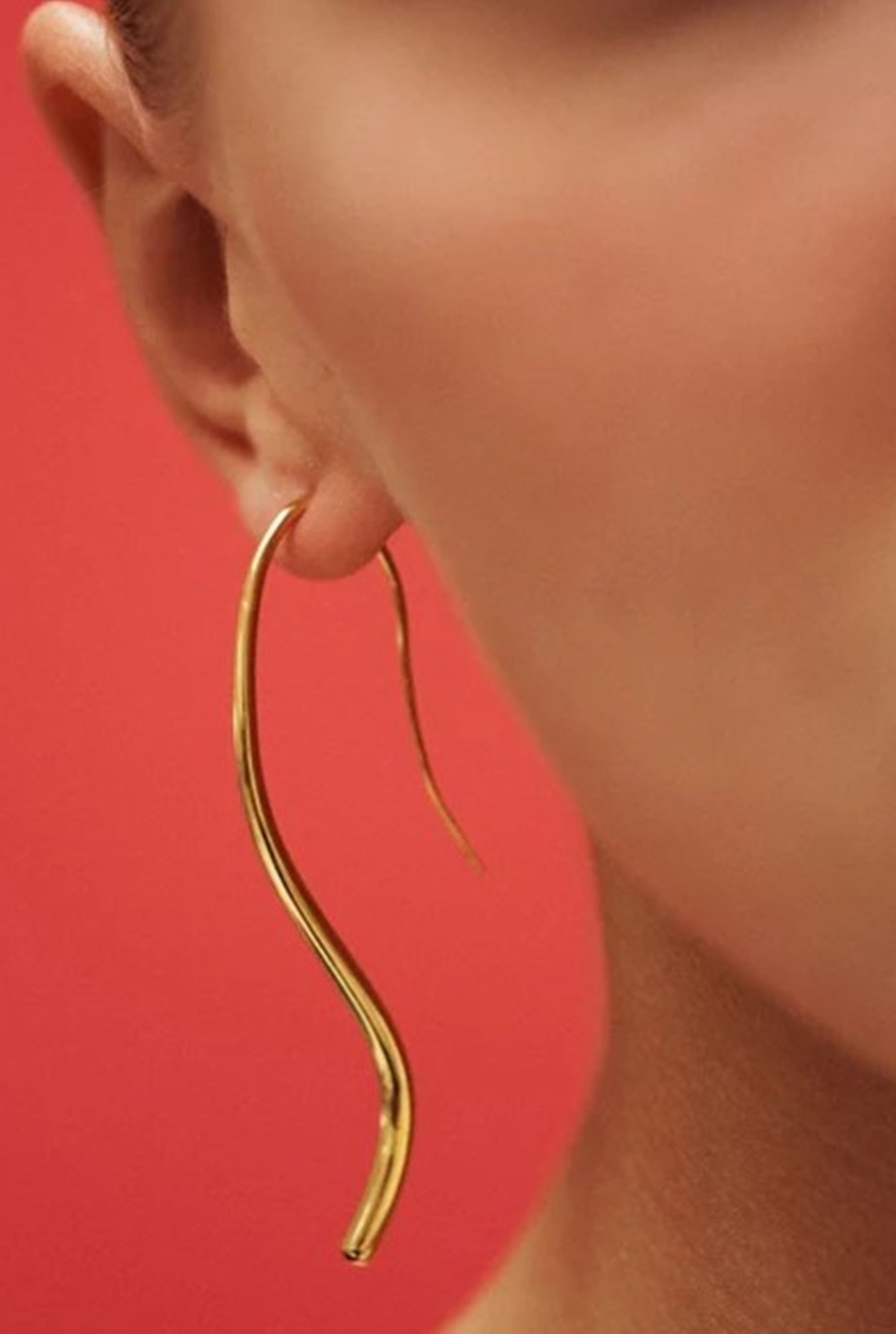image of a woman wearing the Heaven Mayhem Lenora Earrings in Gold