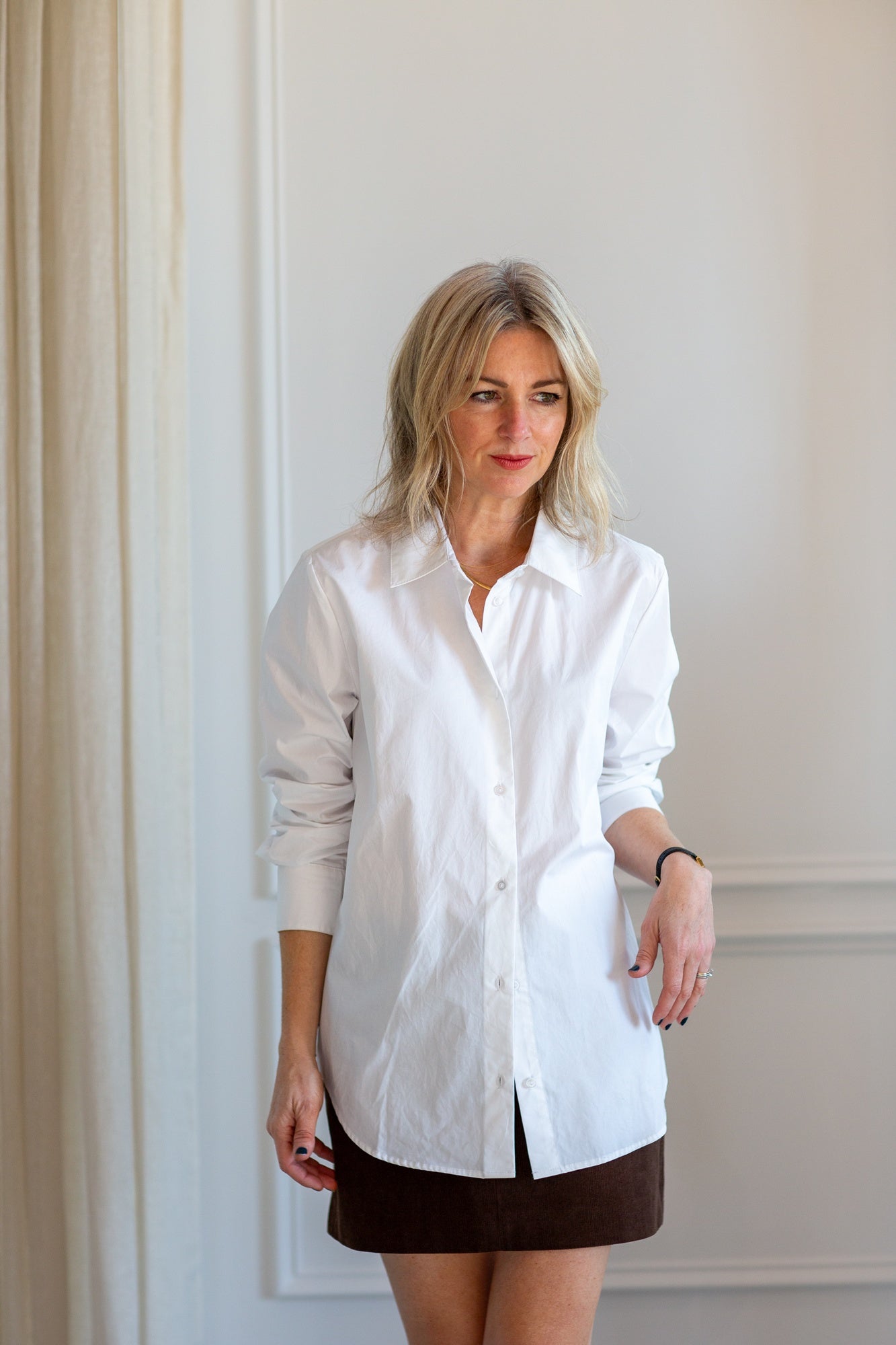 model wearing the herskind joe shirt and seroya azalea mini skirt