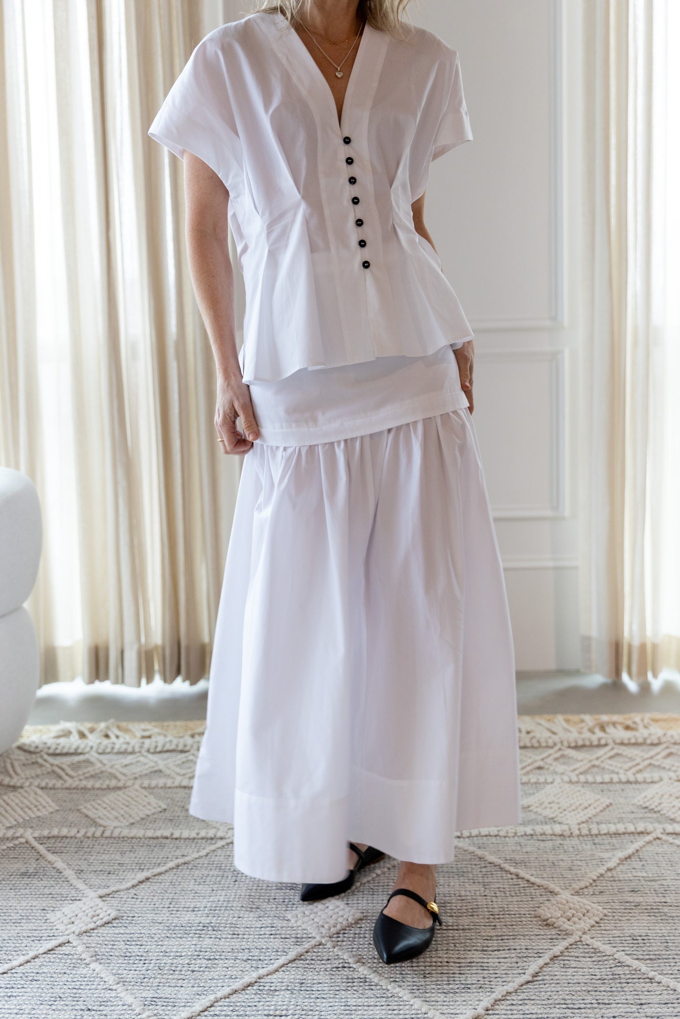 image of a woman wearing the House of Dagmar Cinched Cotton Top and Maxi Skirt
