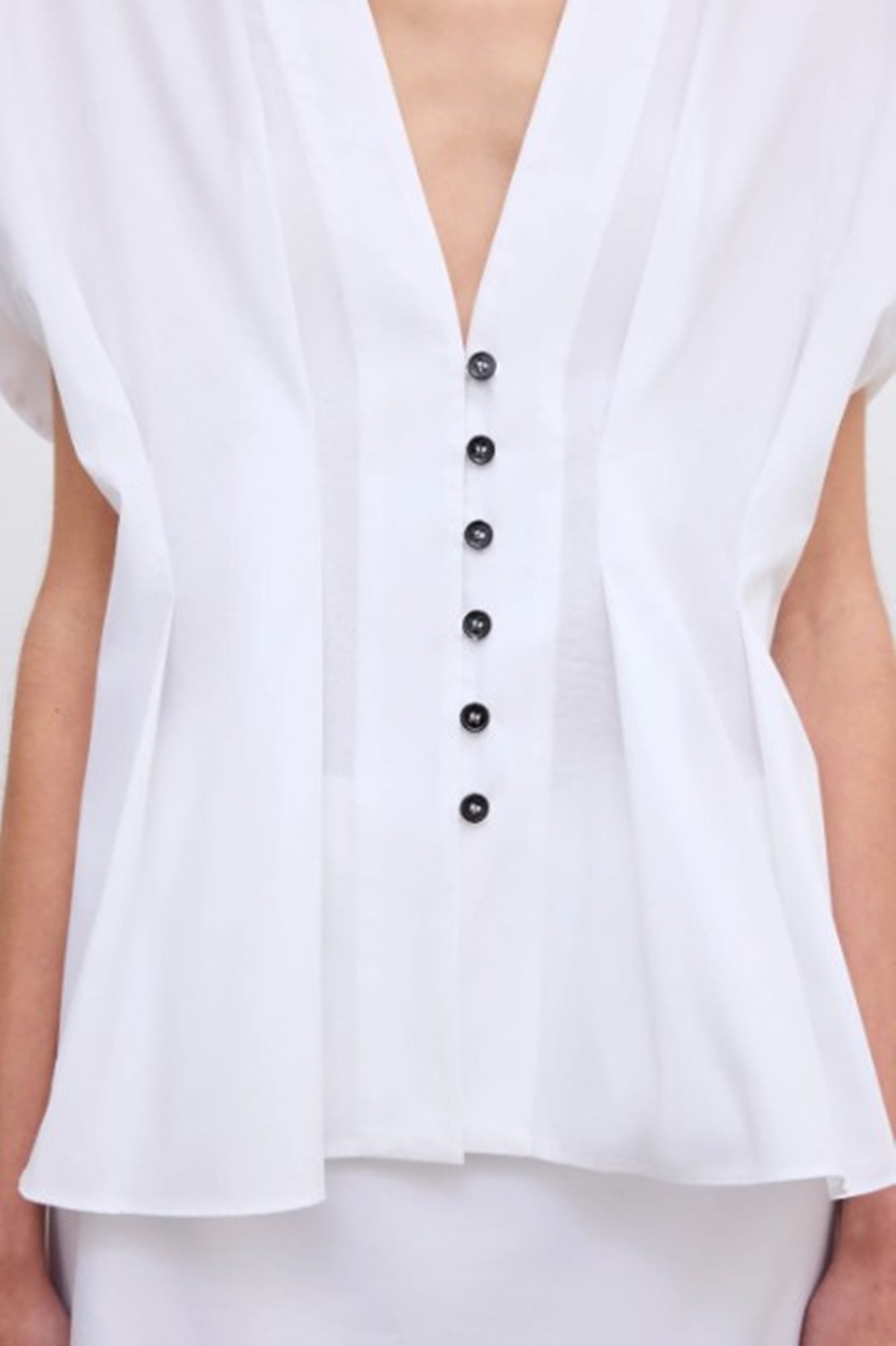 close up of a model wearing the House of Dagmar Cinched Cotton Top