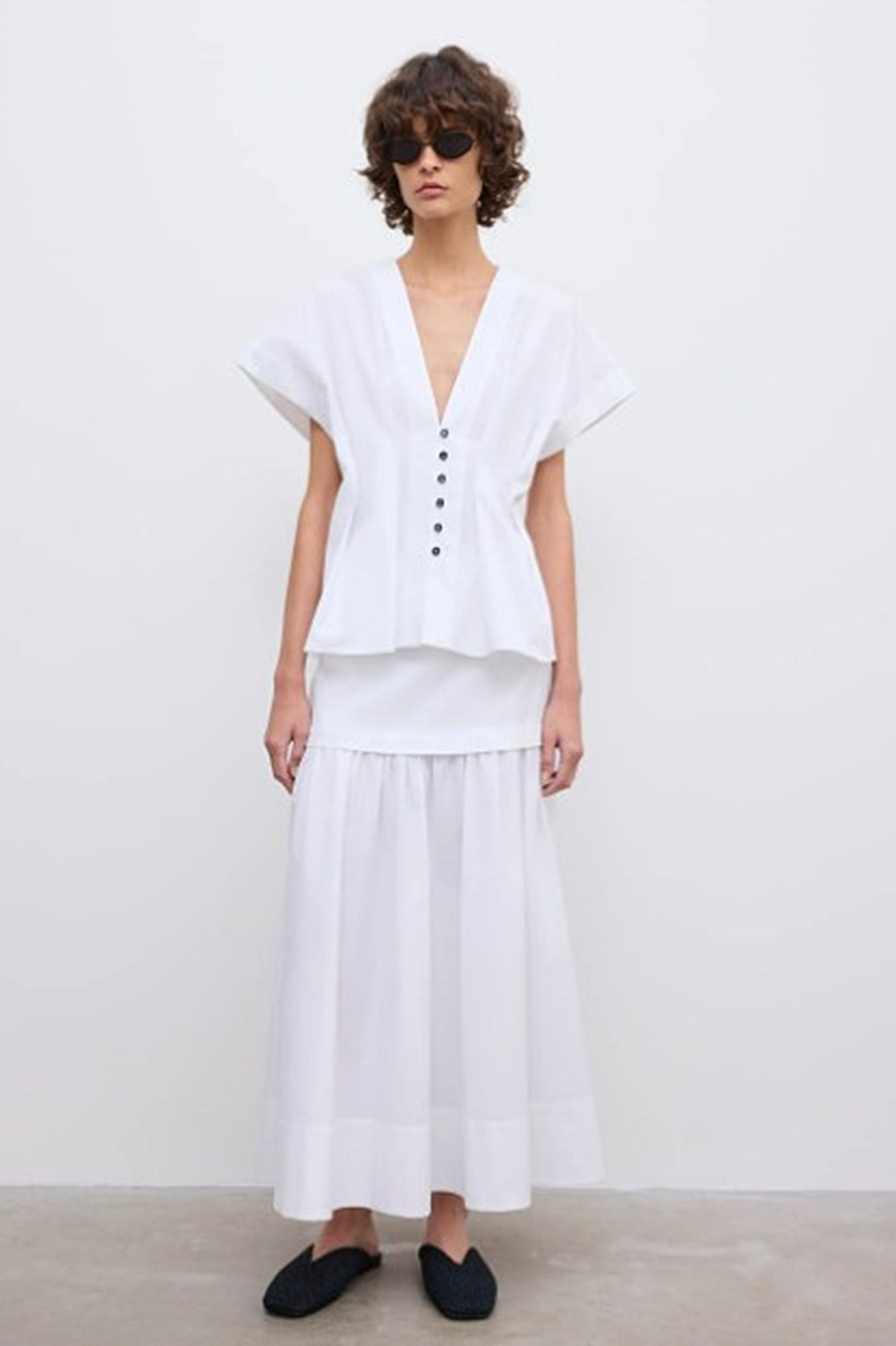image of a woman wearing the House of Dagmar Cinched Cotton Top and Maxi Skirt