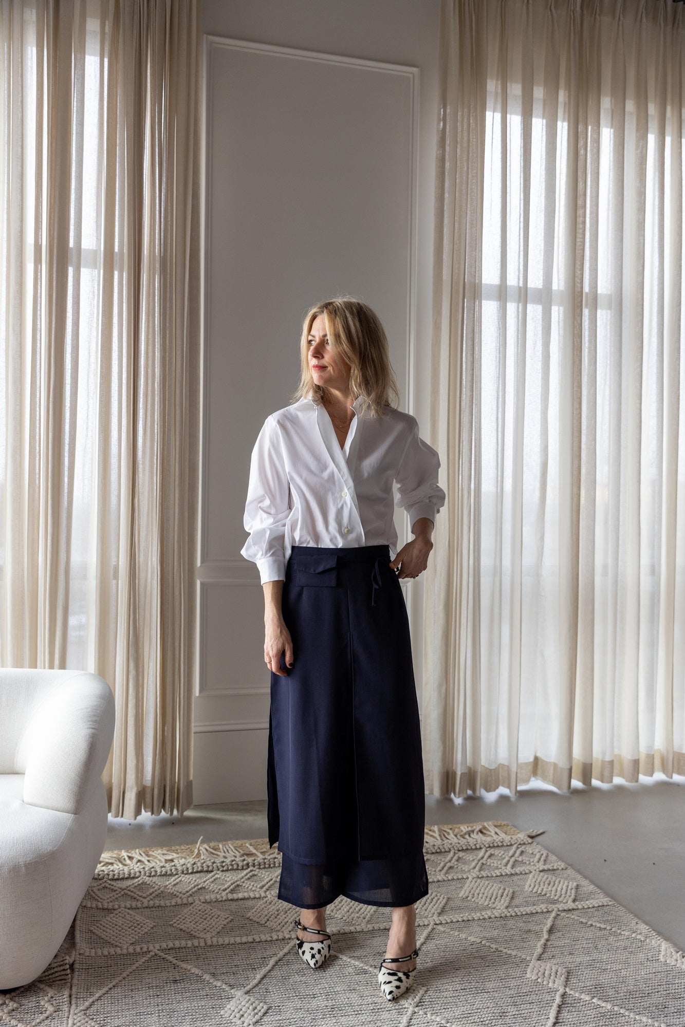 image of a woman wearing the house of dagmar cropped shirt and rachel comey gerri pants