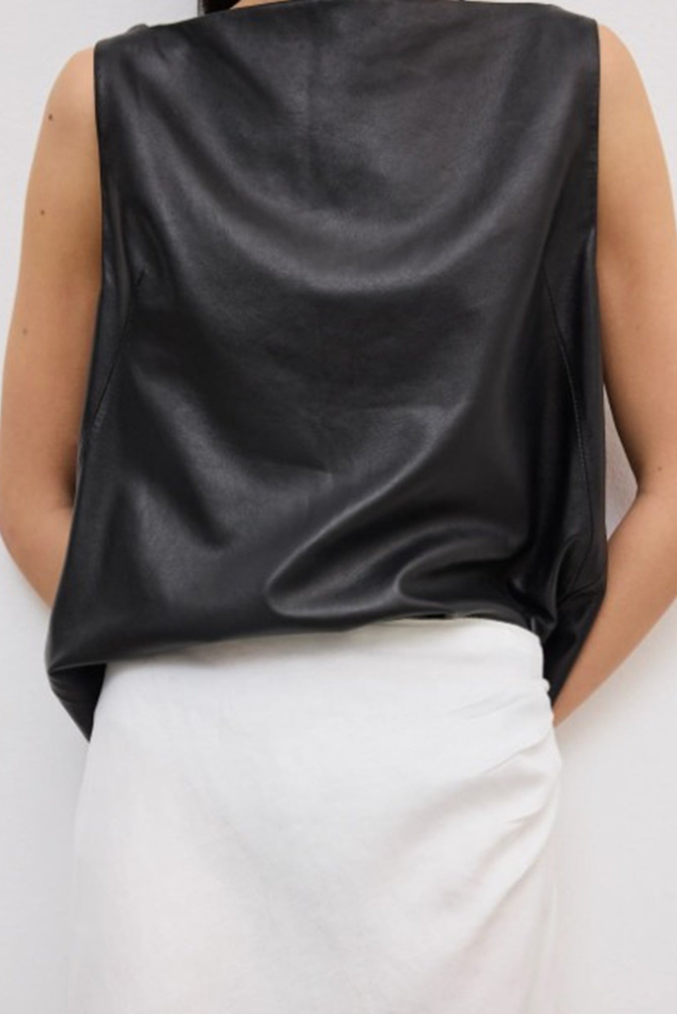 close up of a model wearing the House of Dagmar Draped Midi Skirt
