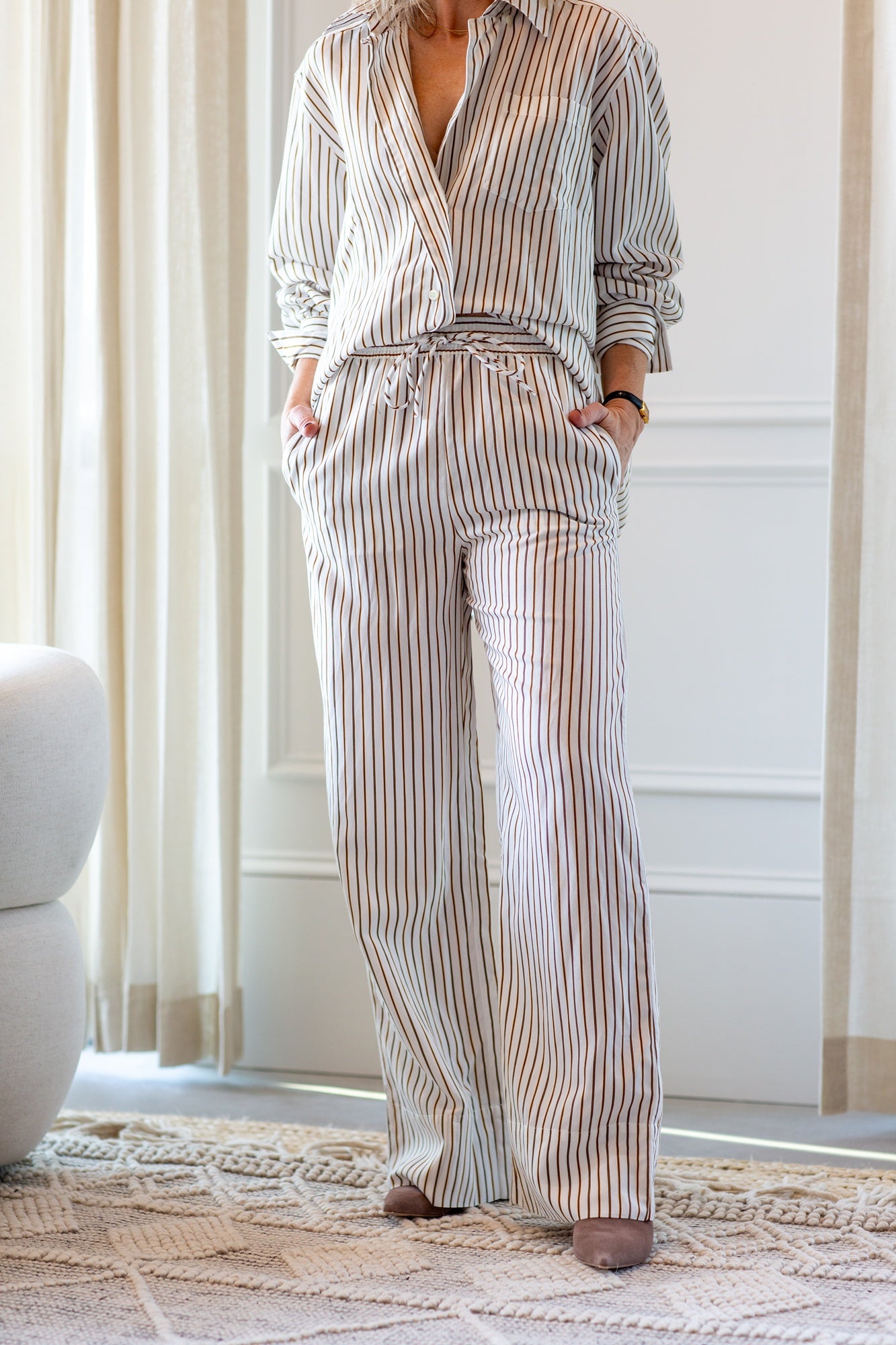 model wearing the house of dagmar fluid stripe relaxed trousers