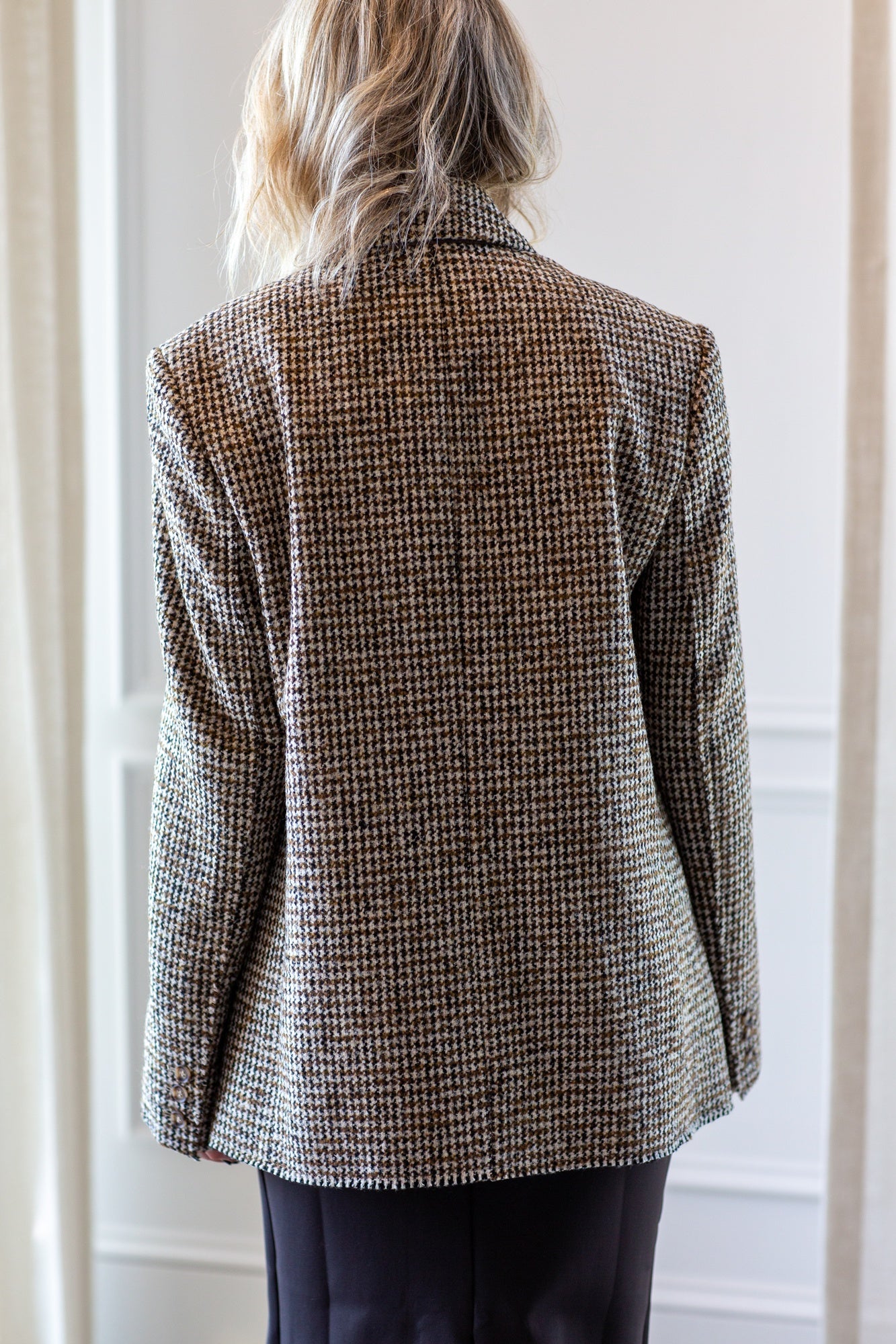 model wearing the house of dagmar houndstooth blazer and sculpted tube dress