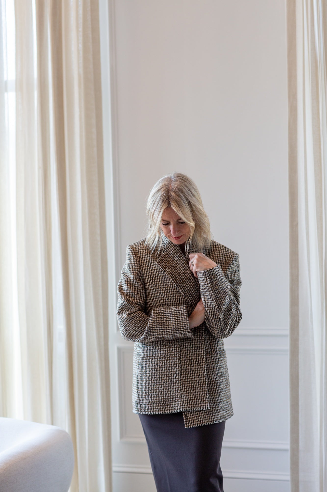 model wearing the house of dagmar houndstooth blazer and sculpted tube dress