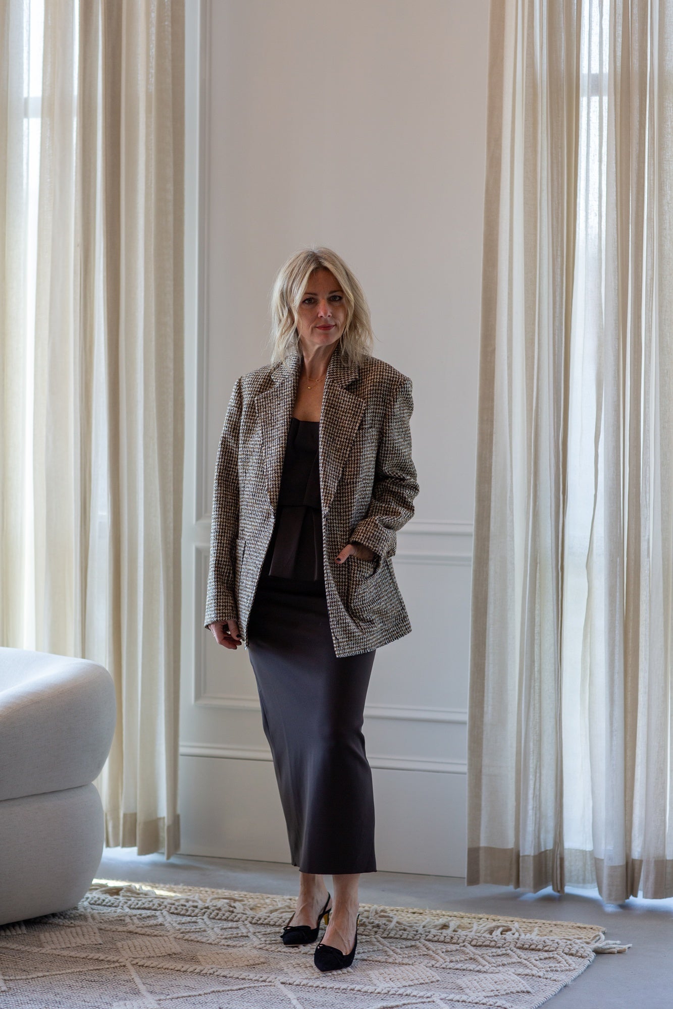 model wearing the house of dagmar houndstooth blazer and sculpted tube dress