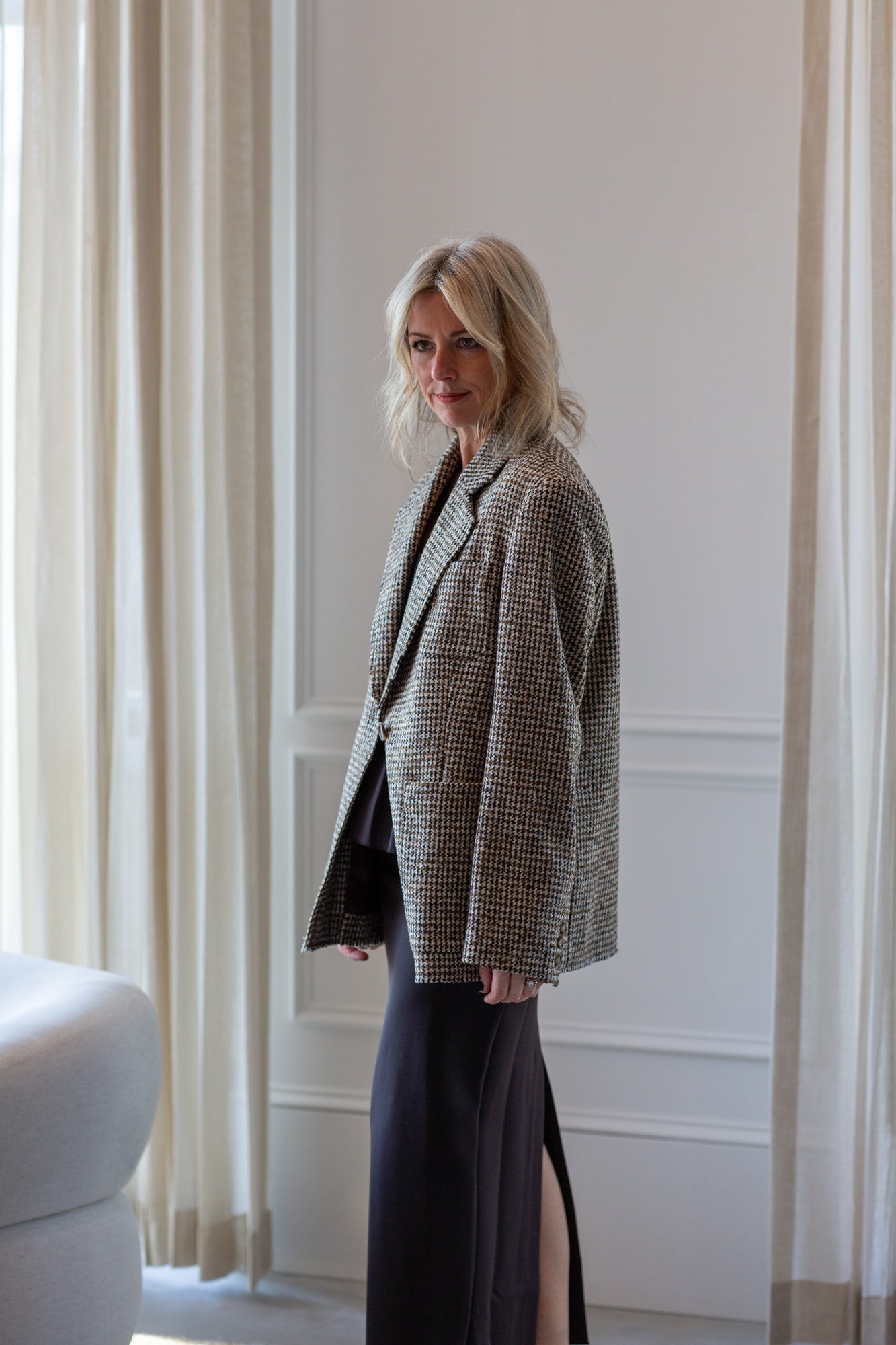 model wearing the house of dagmar houndstooth blazer and sculpted tube dress