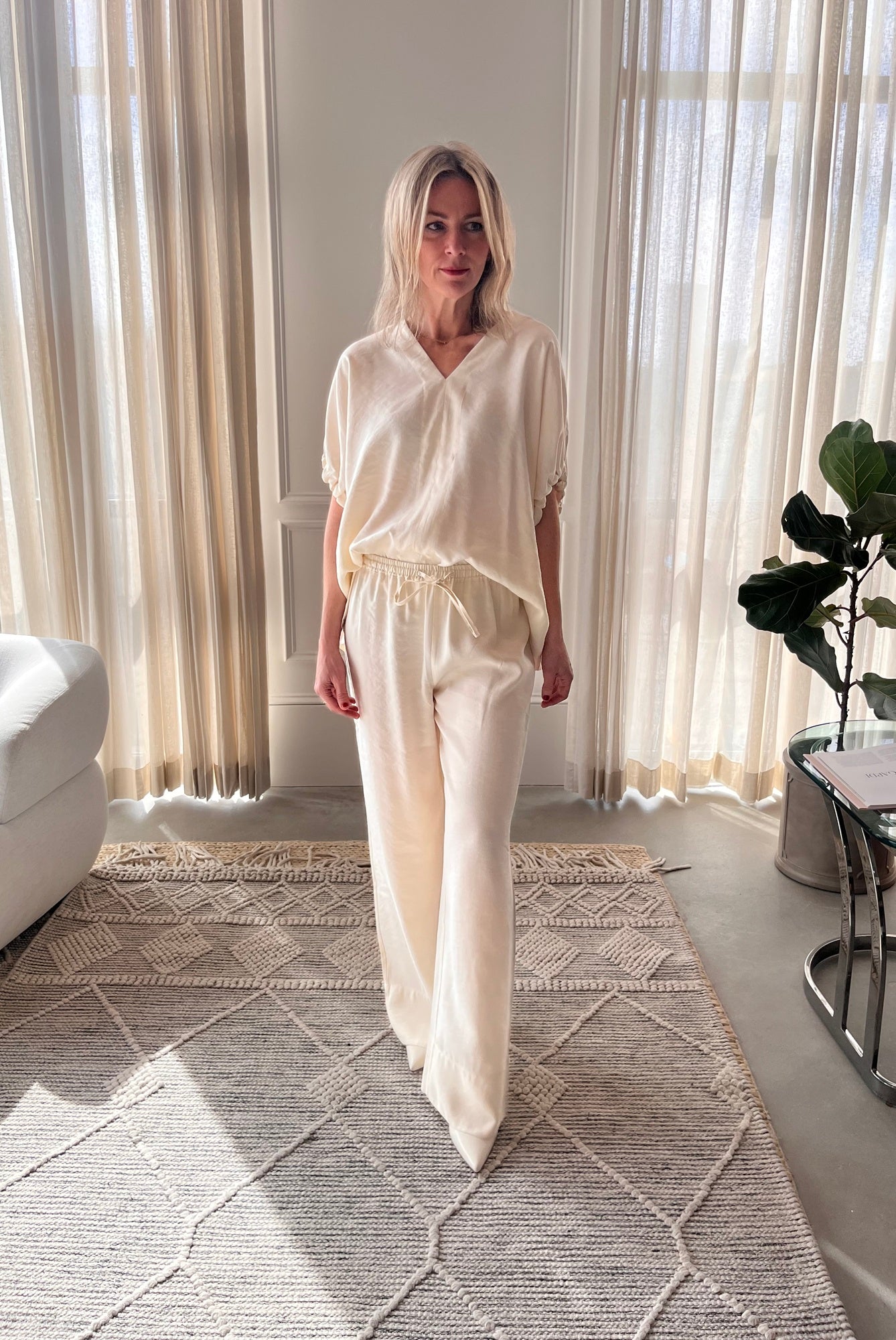 image of a woman wearing the House of Dagmar Rouched Short Sleeve Top and Drawstring Trousers in Ivory