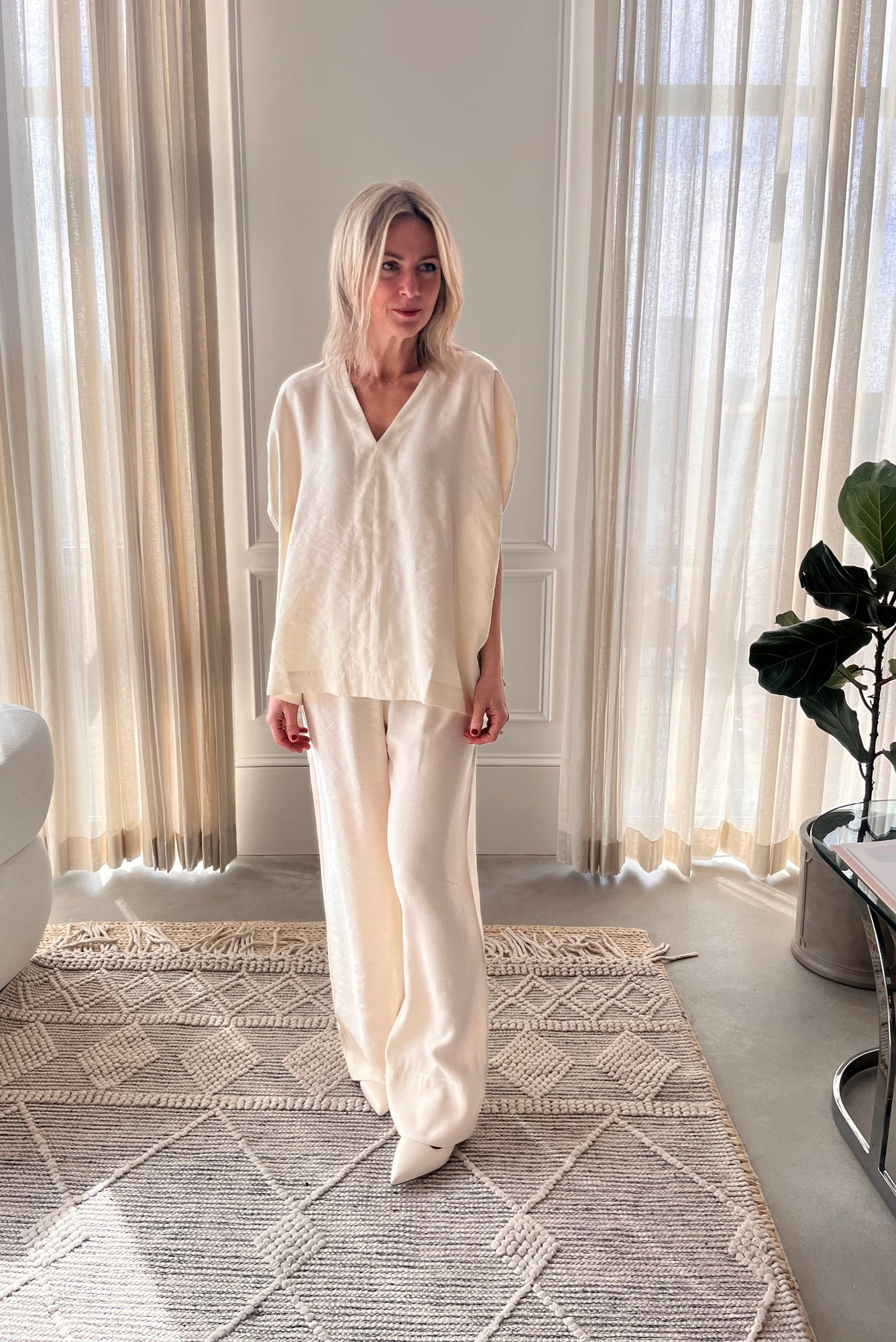 image of a woman wearing the House of Dagmar Rouched Short Sleeve Top and Drawstring Trousers in Ivory