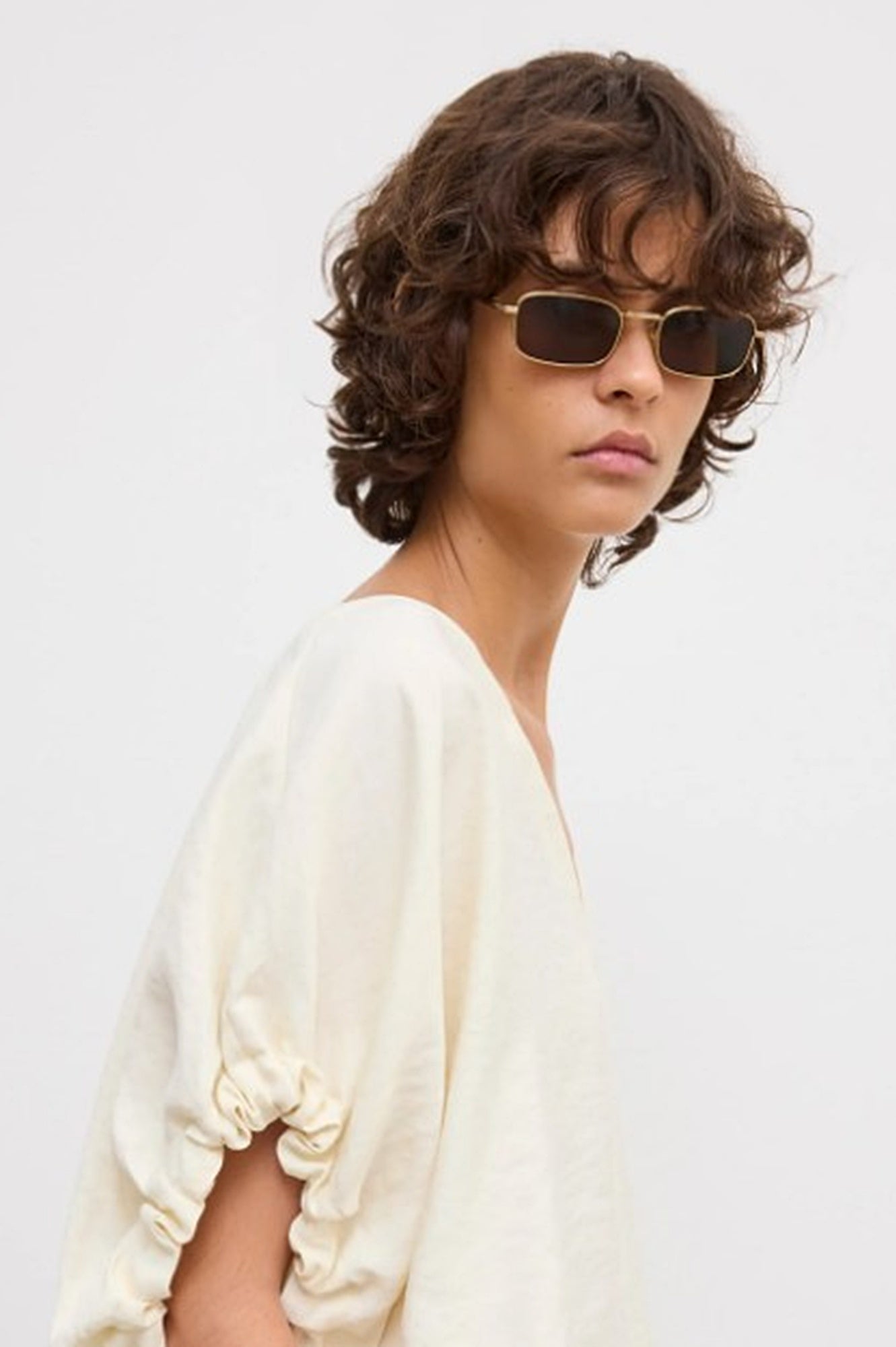 close up image of a woman wearing the House of Dagmar Rouched Short Sleeve Top