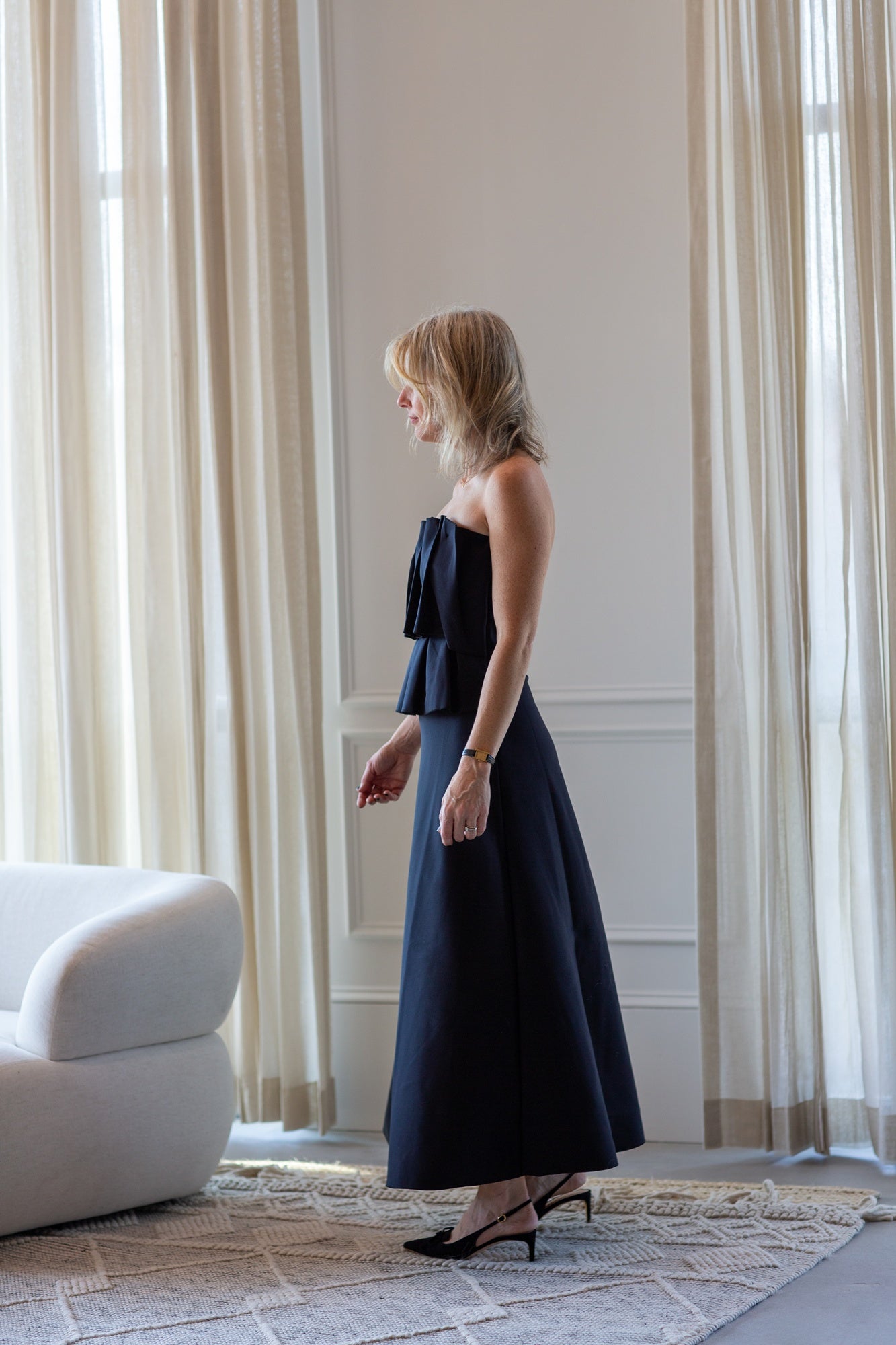 woman wearing the house of dagmar sculpted tube dress in black