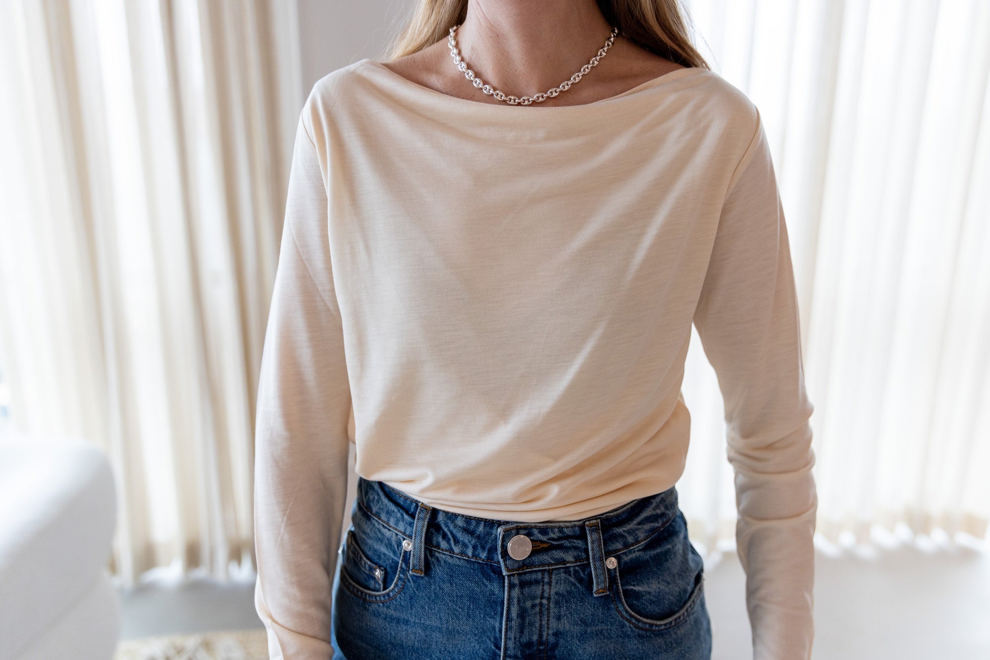 image of a woman wearing the House of Dagmar Square Neck Top and Sablyn Sammy Jeans