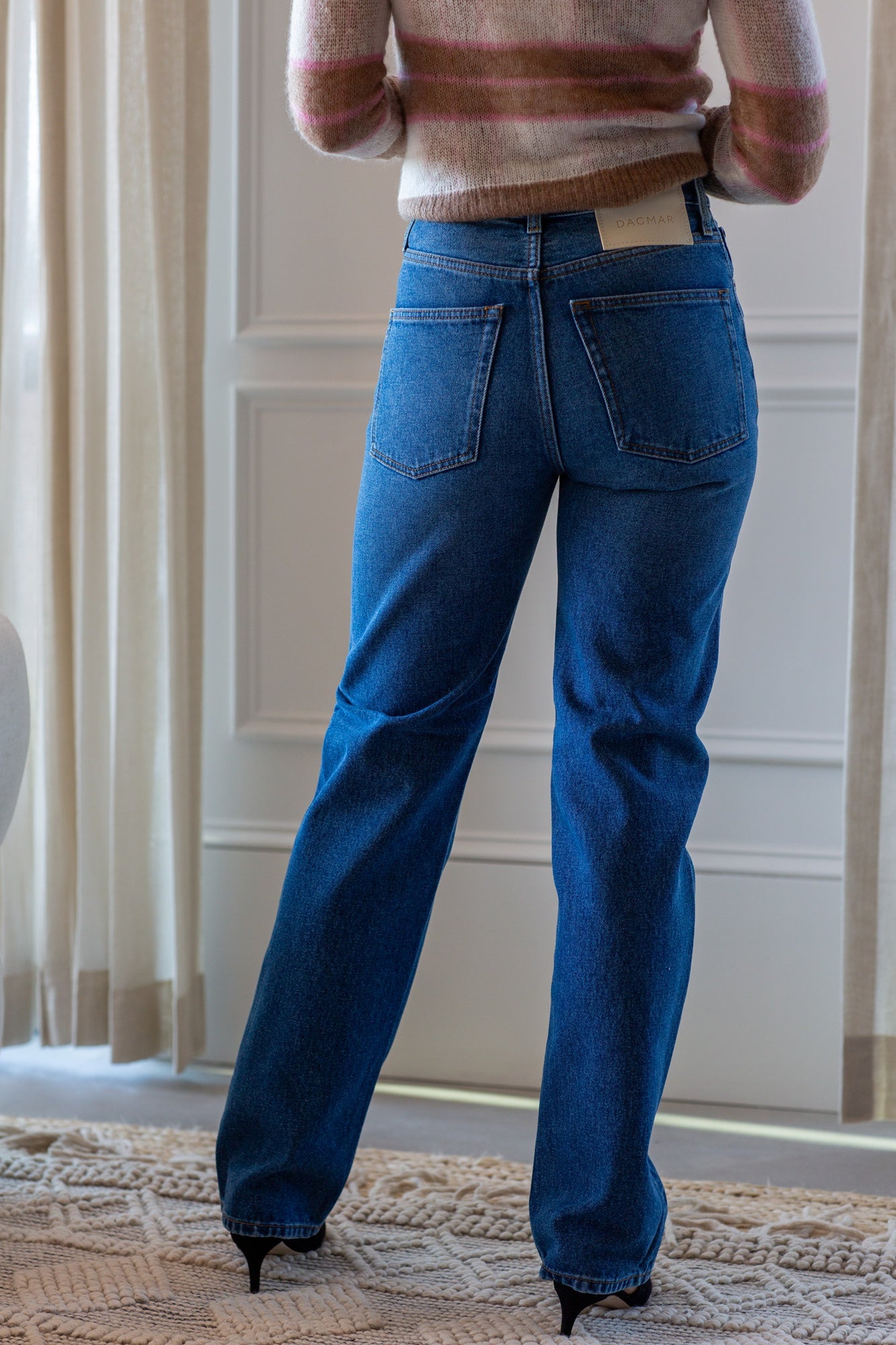 woman wearing the house of dagmar straight leg jeans