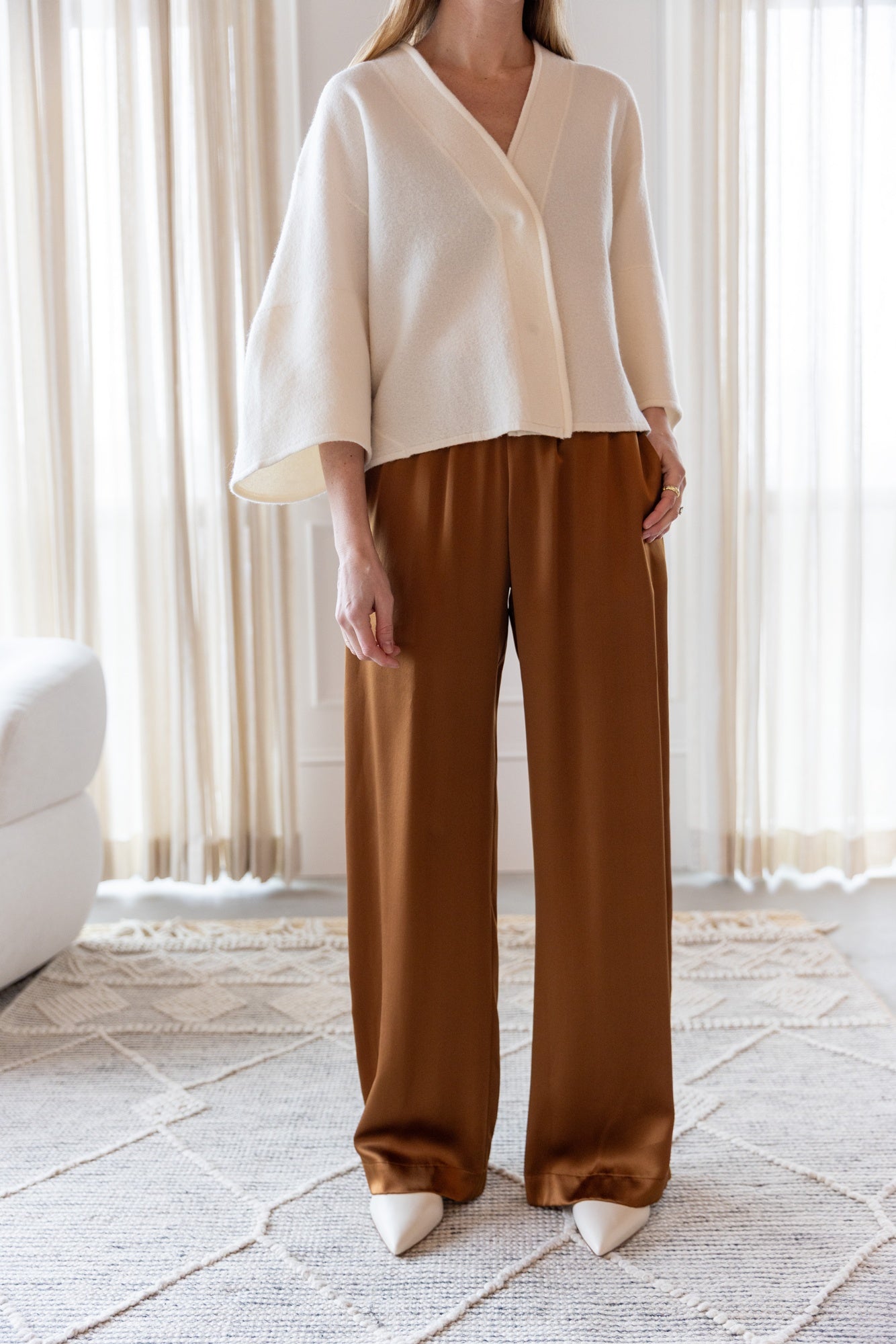 image of a woman wearing the House of Dagmar Wool Cardigan and Sablyn Brynn Pants
