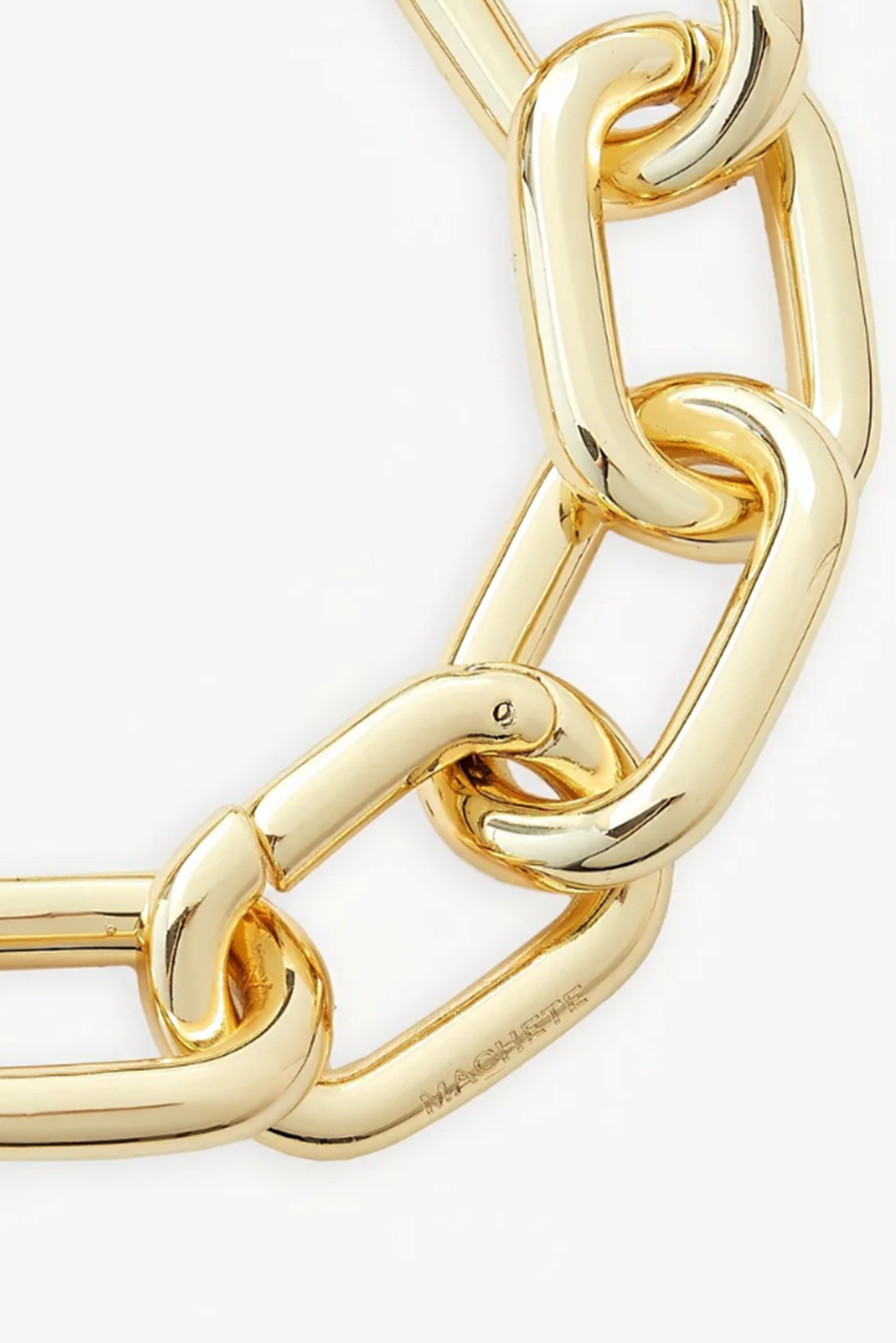 Gold chain bracelet on a white background