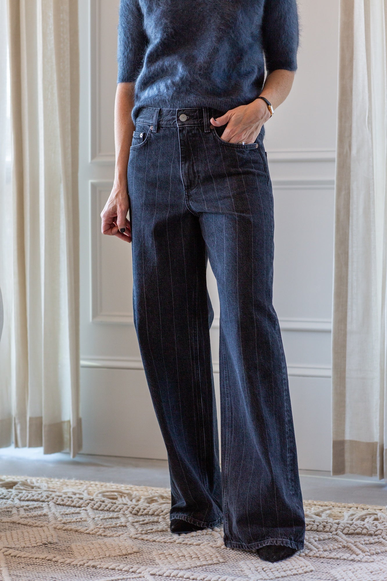 model wearing the lisa yang carolyn brushed cashmere sweater and house of dagmar baggy cut jeans