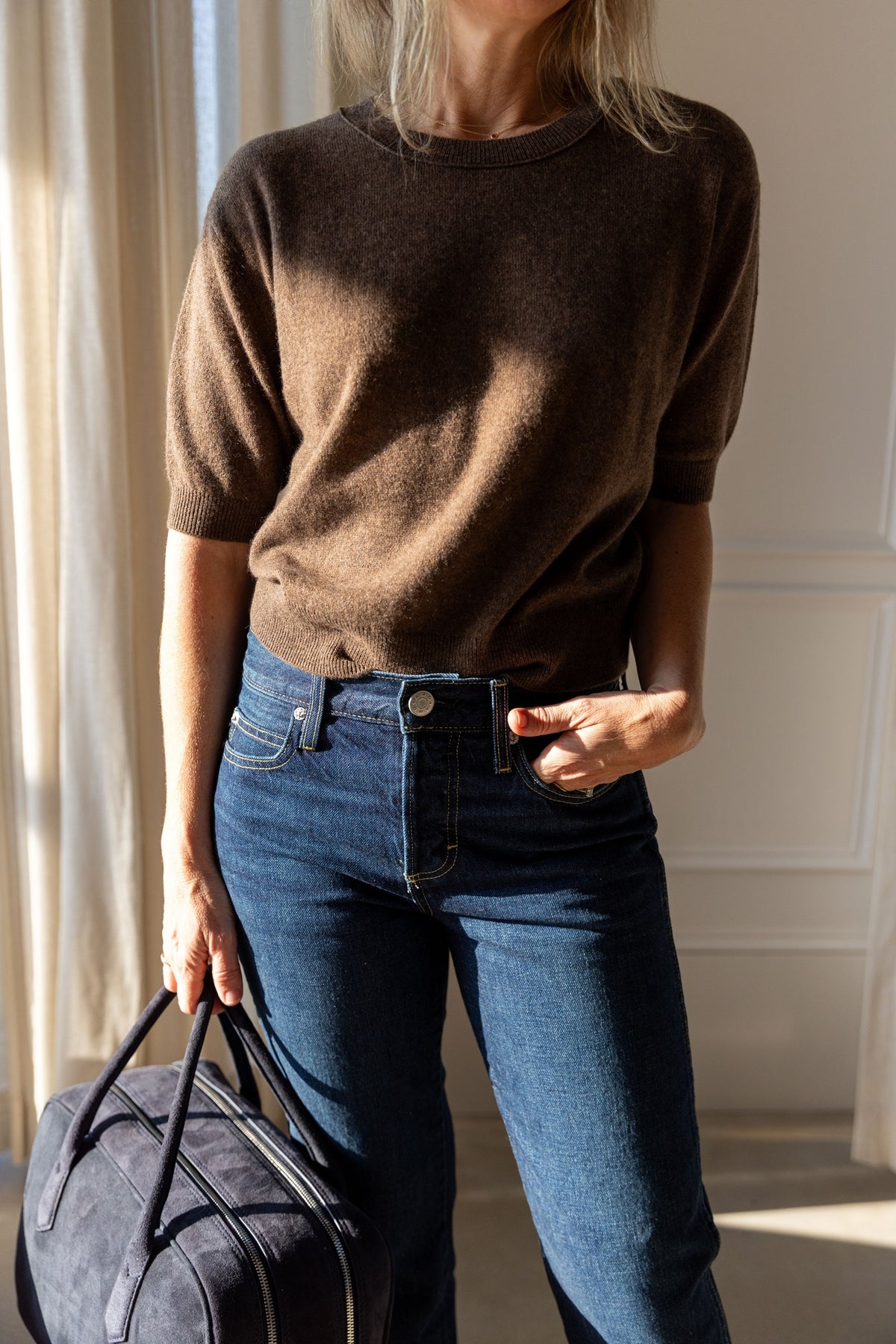 Lisa Yang Genevra T-Shirt in dark truffle cashmere with voluminous short sleeves, styled with AMO jeans and an A. Emery Talbot bag