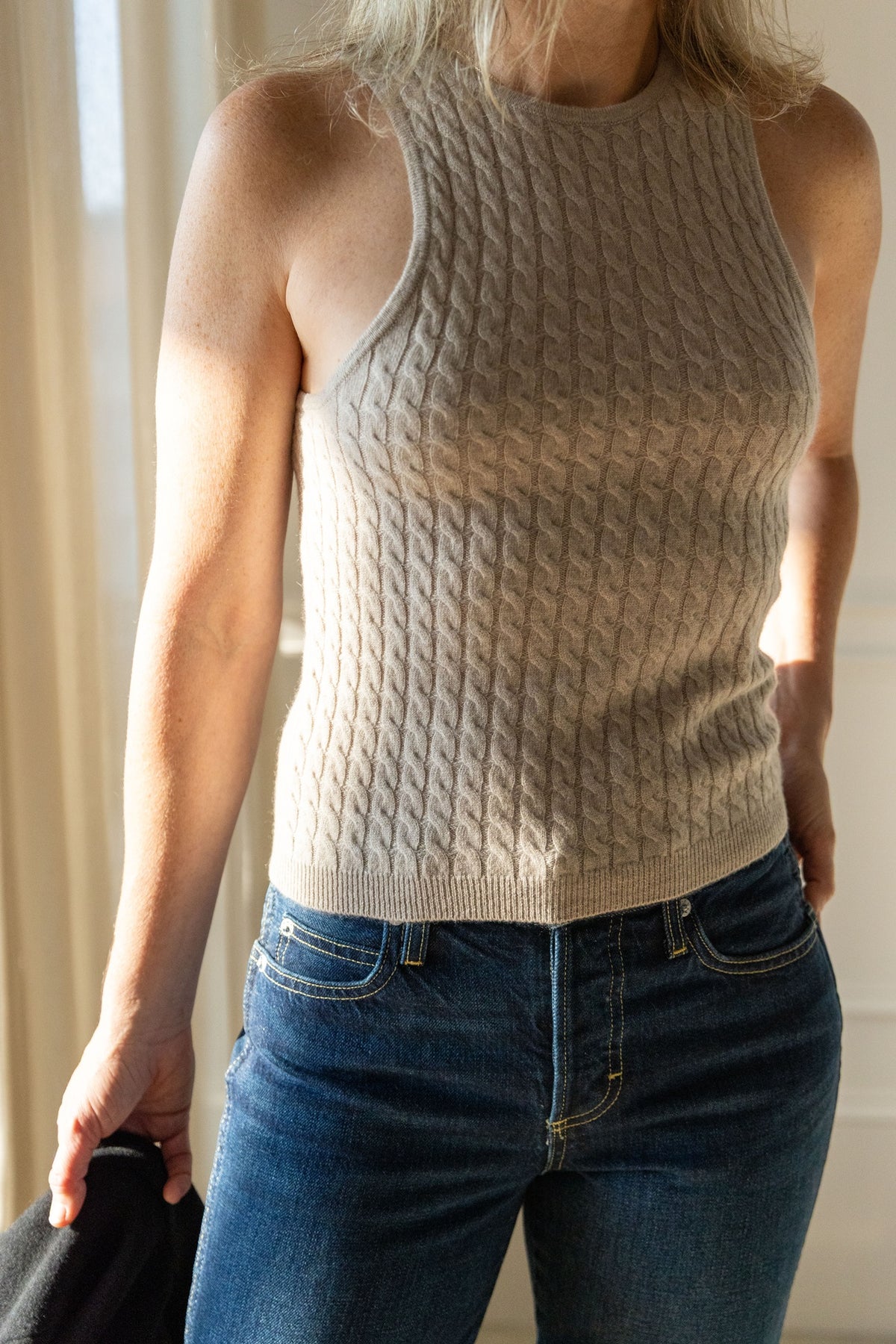 Lisa Yang Iora Top in sand cable-knit cashmere, sleeveless crew neck, styled with AMO 143 jeans