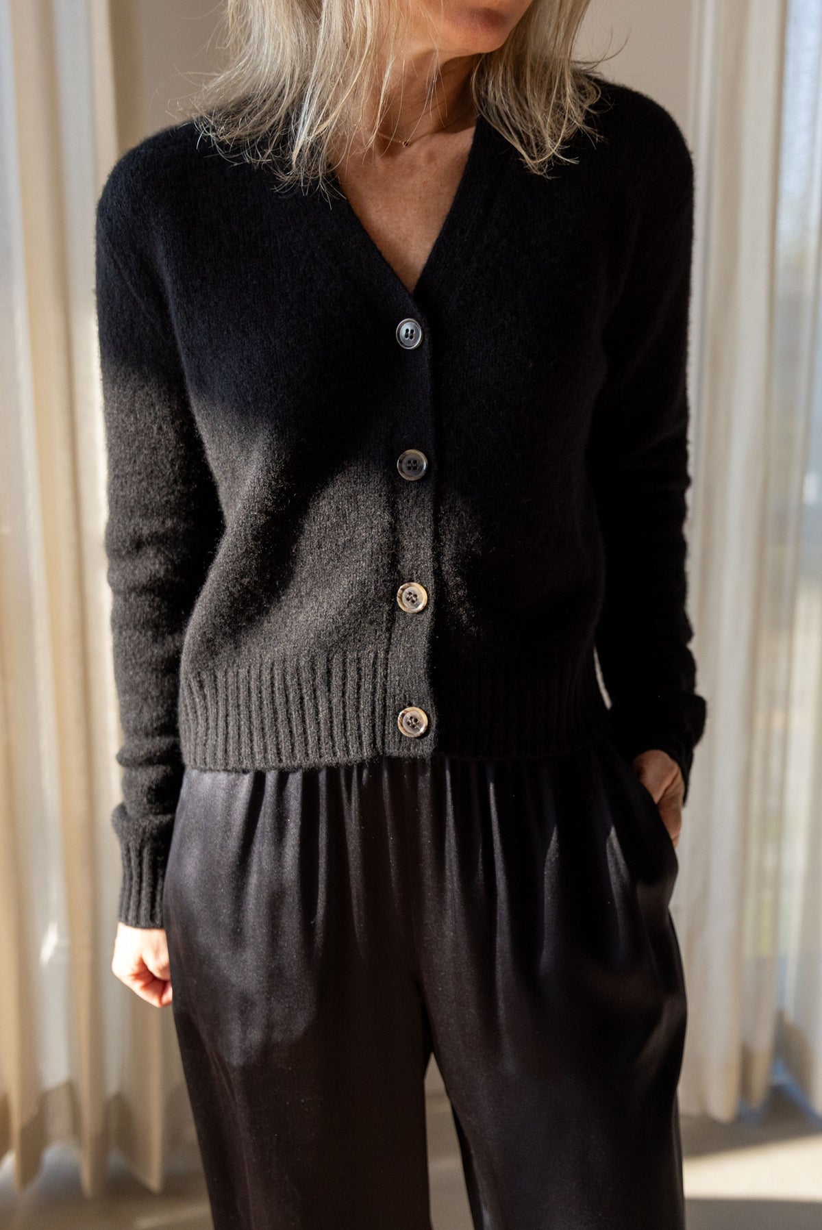 Lisa Yang Marionette Cardigan in black silk cashmere, V-neck button front, styled with Sablyn Brynn silk pants