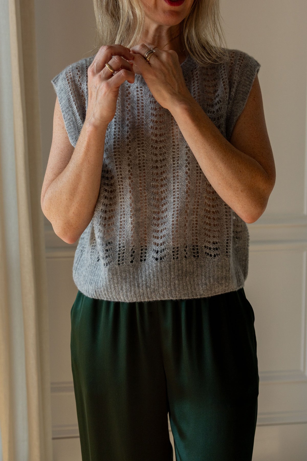 Lisa Yang Nian Vest in cloudy grey open-weave silk cashmere, styled with green Sablyn Brynn silk pants