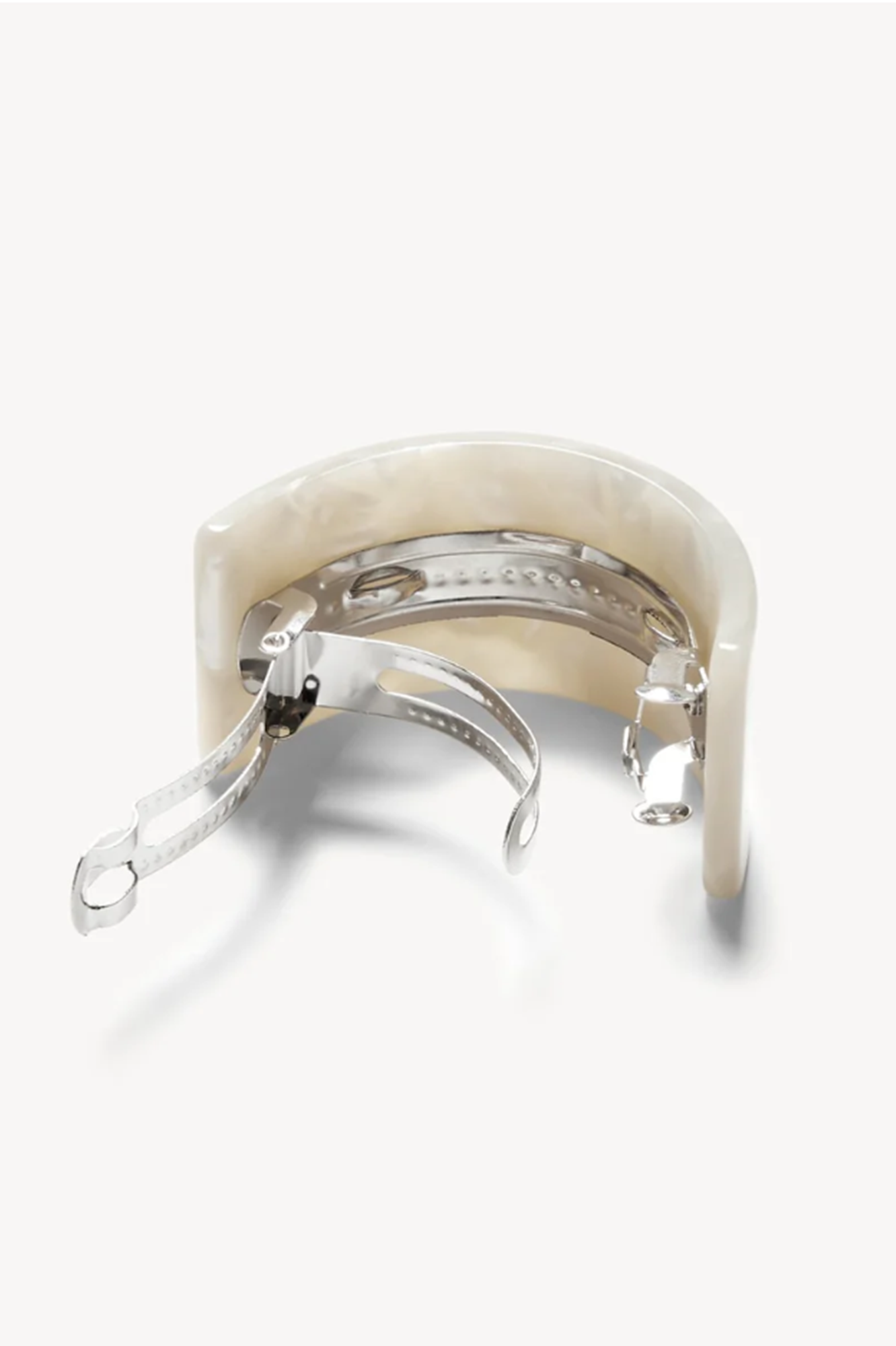 Back side of a sea white french pony barrette on a white background