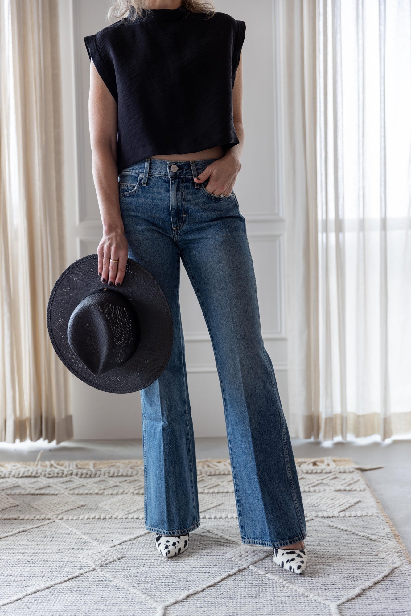 image of a woman wearing the Rachel Comey Bacchus top and Amo Marcenia Jeans