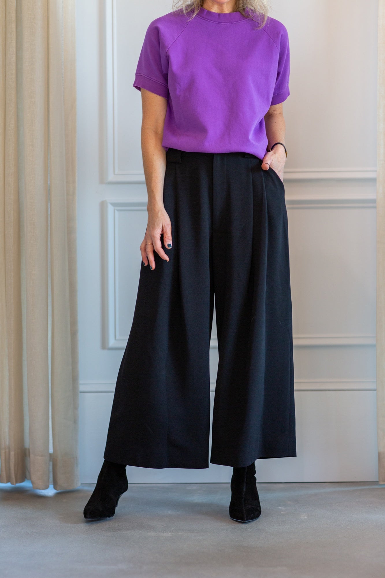 model wearing the rachel comey billi sweatshirt and wolcott pants