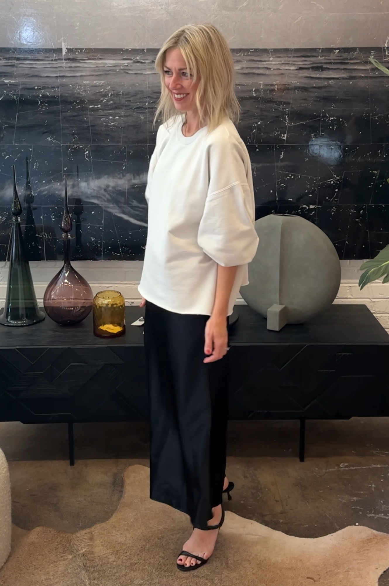 Image of a woman wearing the Rachel Comey Fond Sweatshirt, Eterne Silk Skirt and Studio Amelia Sienna Heels