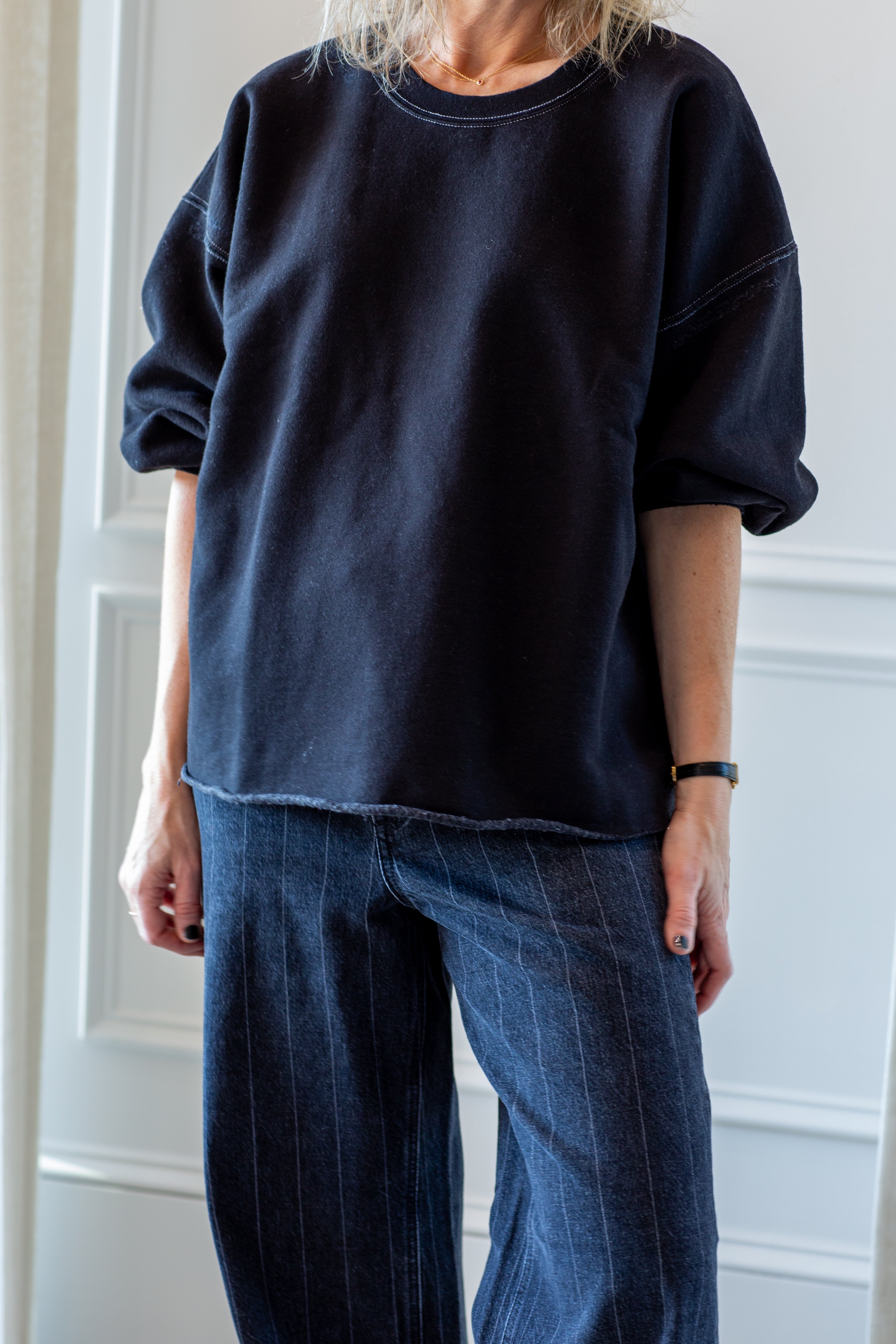 woman wearing the rachel comey fond sweatshirt in charcoal