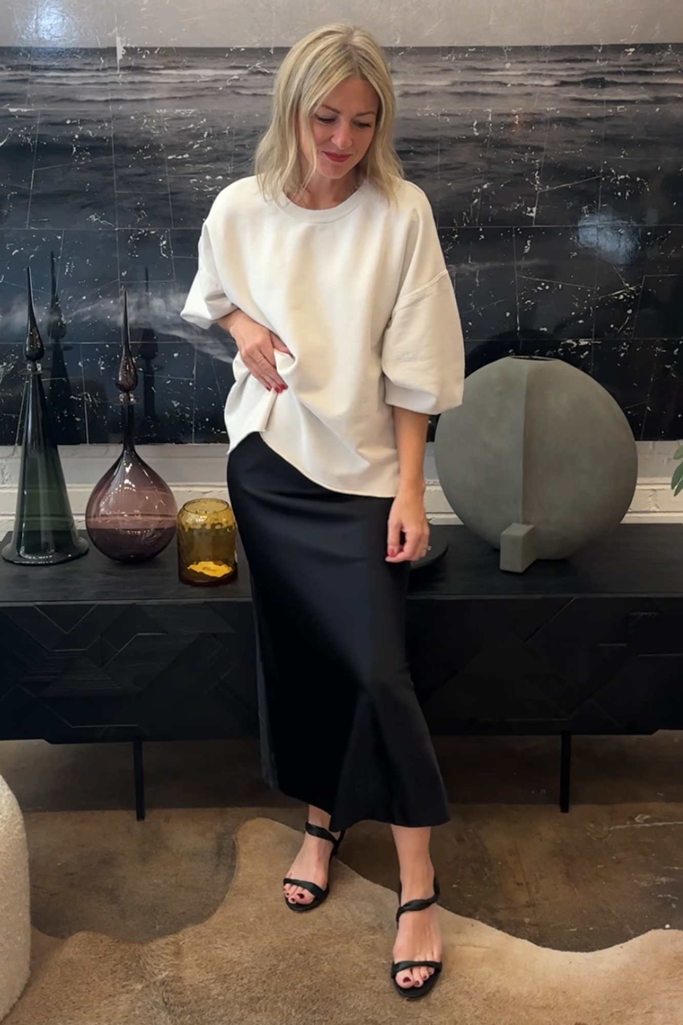image of a woman wearing the Rachel Comey Fond Sweatshirt and Eterne Silk Skirt and Studio Amelia Sienna Heels