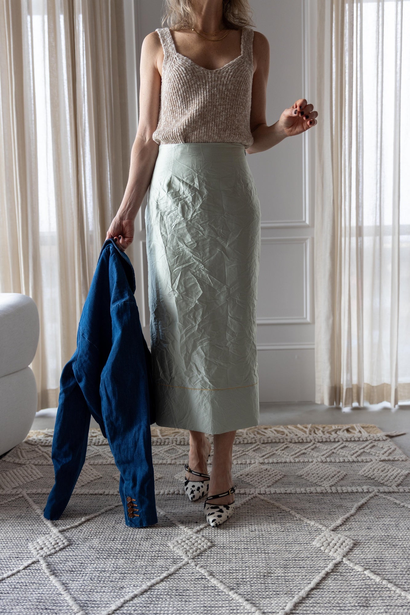 image of a woman wearing the Amo Romy Knit Tank and Rachel Comey Vick Skirt