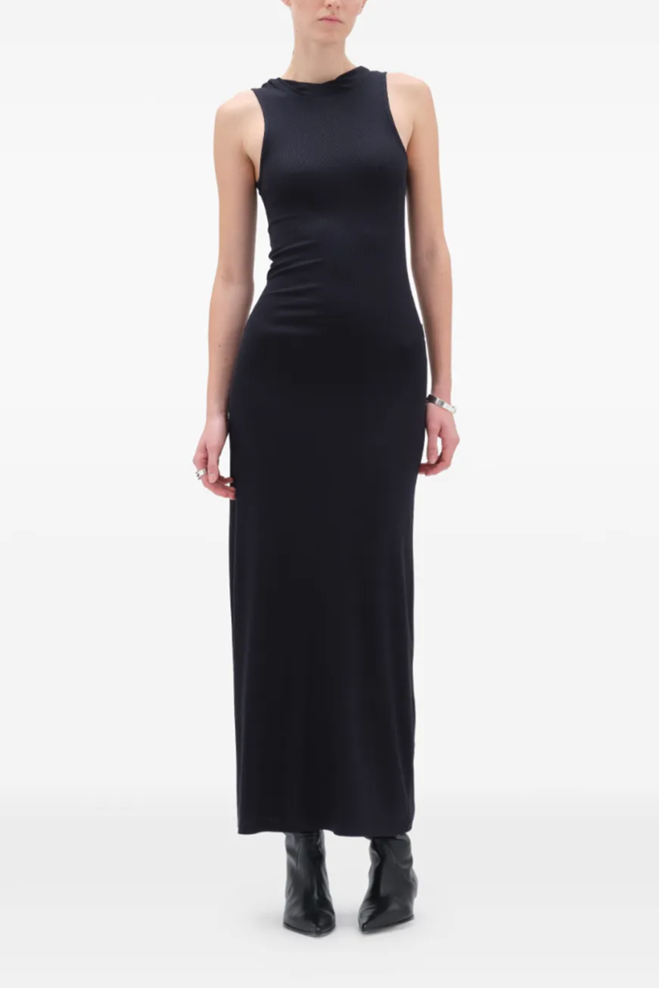 Person wearing a black sleeveless dress on a white background