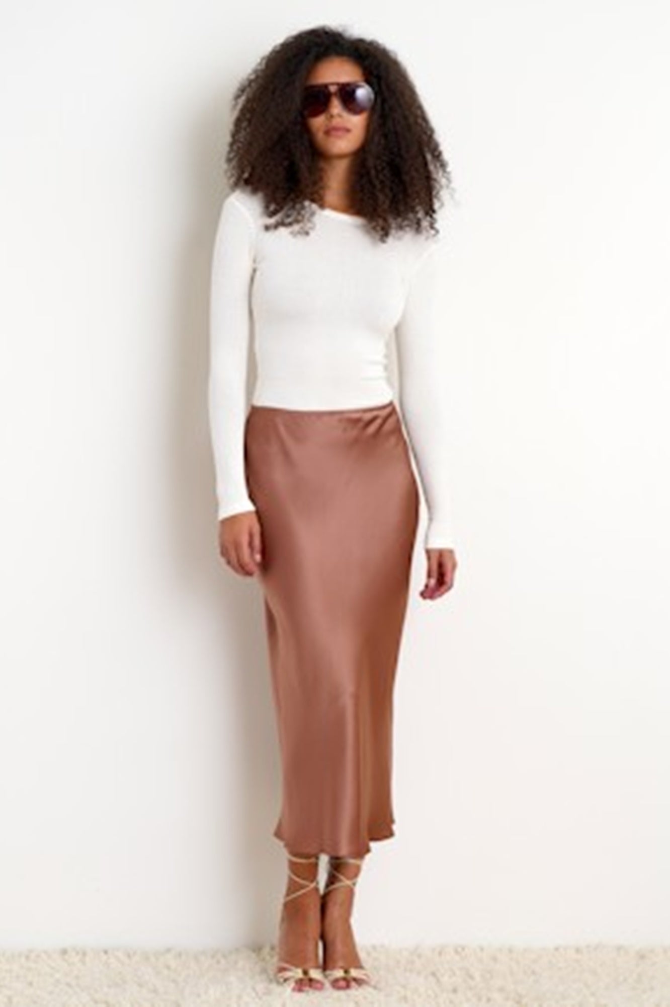 image of a model wearing the Sablyn Miranda b Scallp Trim Bias skirt in prairie sand
