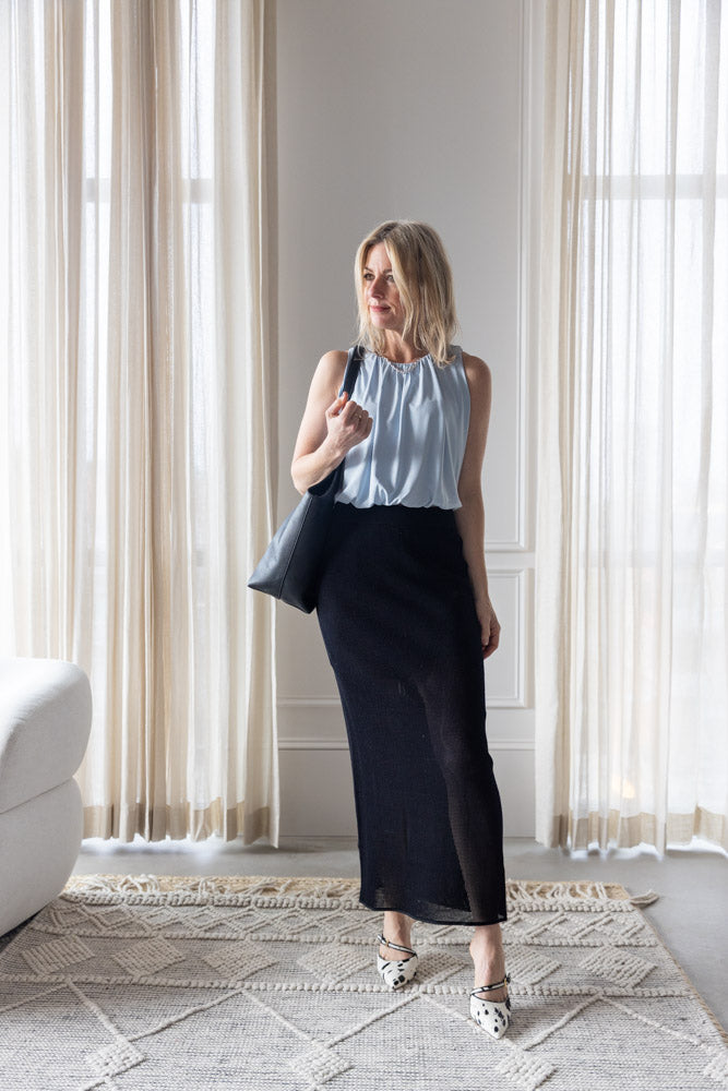 image of a woman wearing the Sablyn Whitney Cropped Tank and Alysi Mesh Knit Skirt