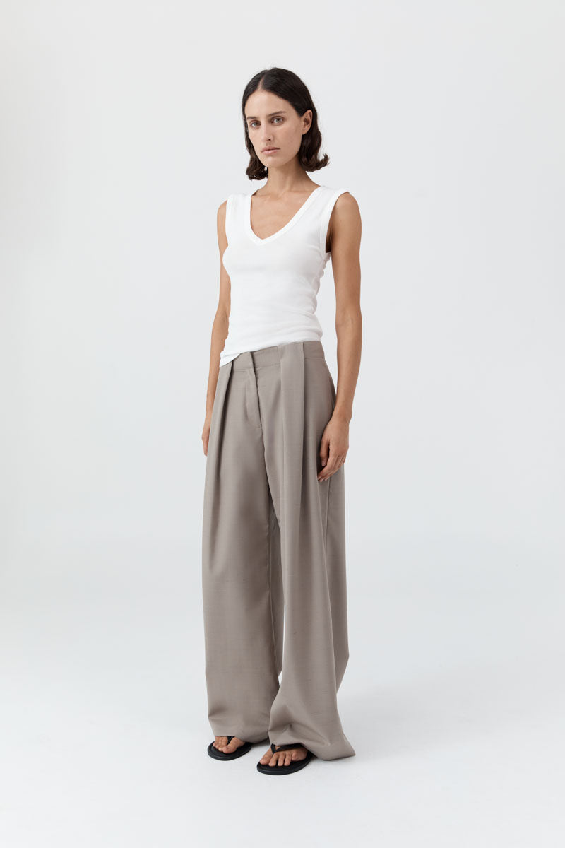 image of a model wearing the organic cotton 90s tank in white