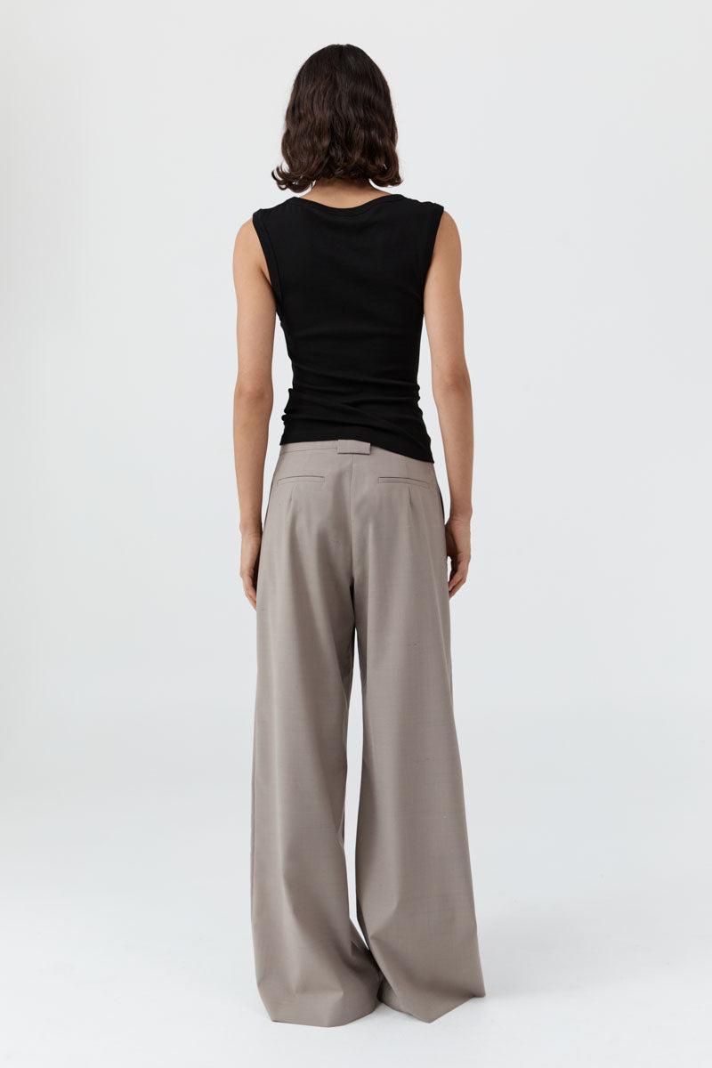 image of a woman wearing the st agni organic cotton 90s tank in black