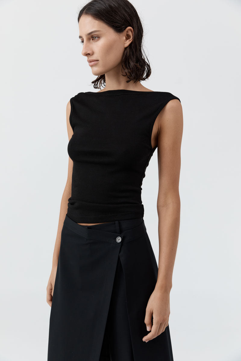 image of a model wearing the st agni organic cotton ballerina top in black