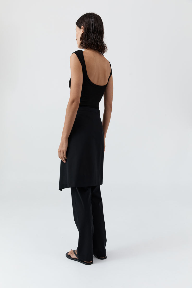 image of a woman wearing the st agni organic cotton ballet top in black