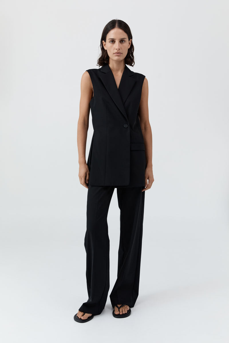 image of a model wearing the st agni sleeveless split blazer