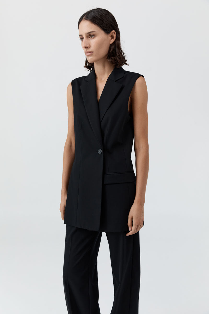 image of a woman wearing the st agni sleeveless split blazer
