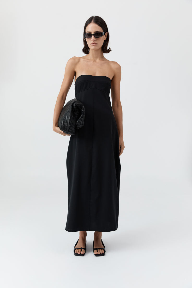 image of a model wearing the st agni wool strapless cocoon dress