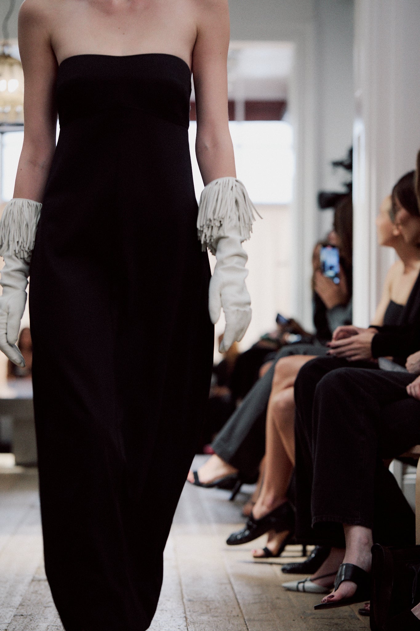 image of a model on a runway wearing the st agni wool strapless cocoon-dress