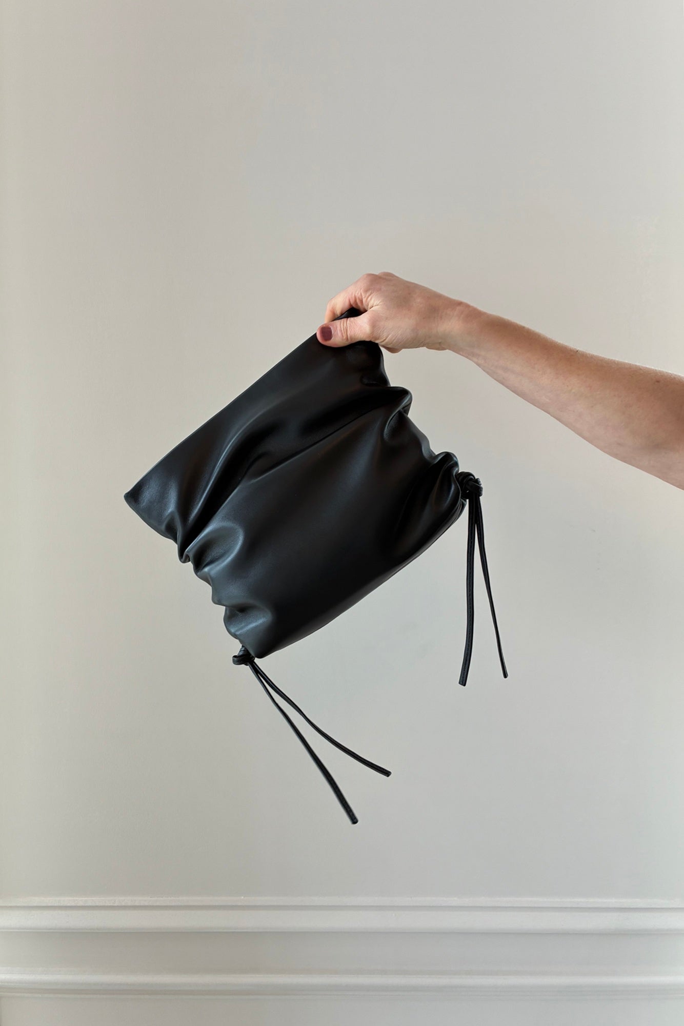 image of the Studio Amelia Ruched Clutch in black