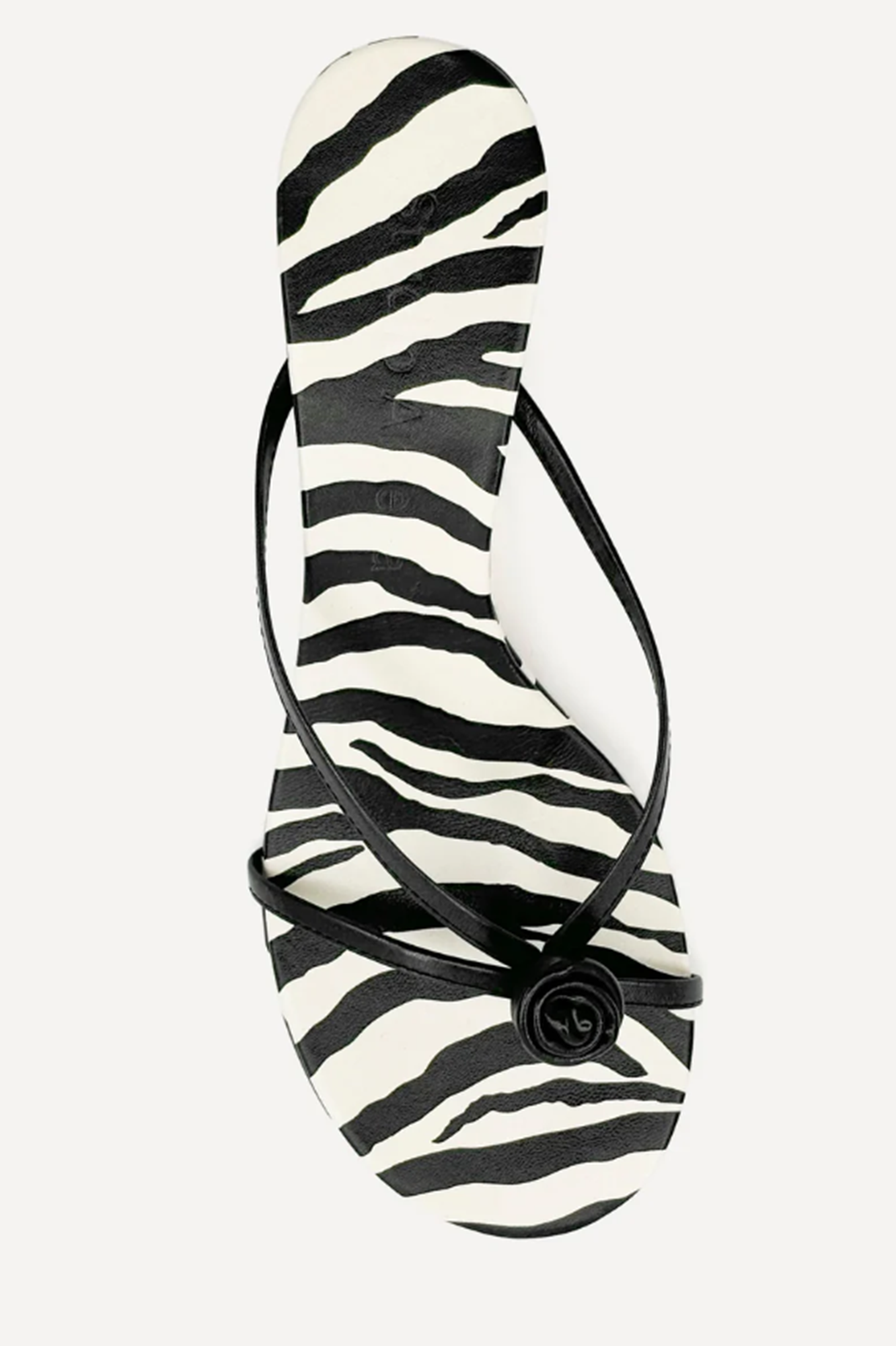 Zebra-patterned sandal on a white background