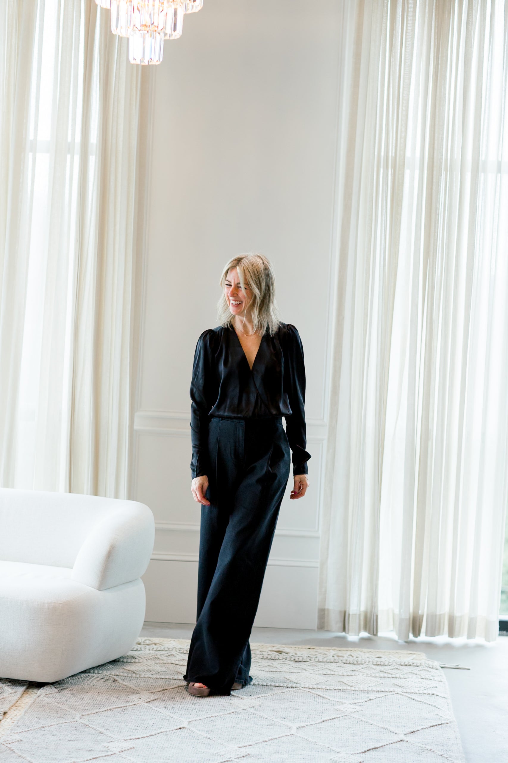 image of a woman wearing the garment catania blouse in black