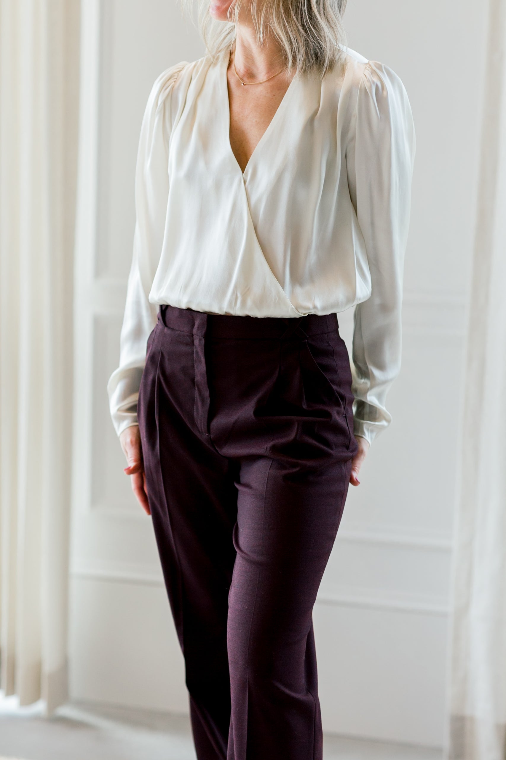 image of a woman wearing the garment catania blouse cream