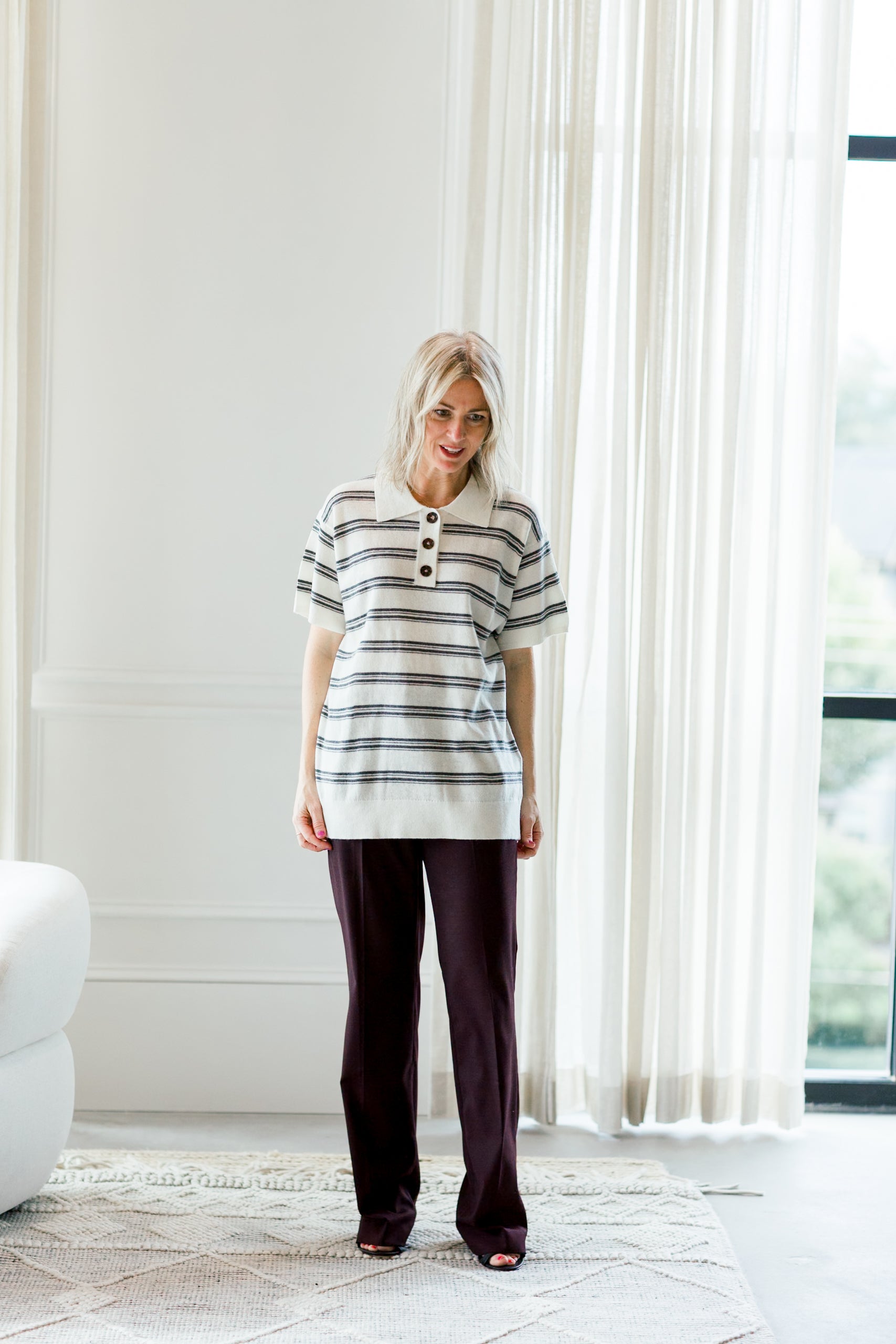 image of a woman wearing the garment como dads polo